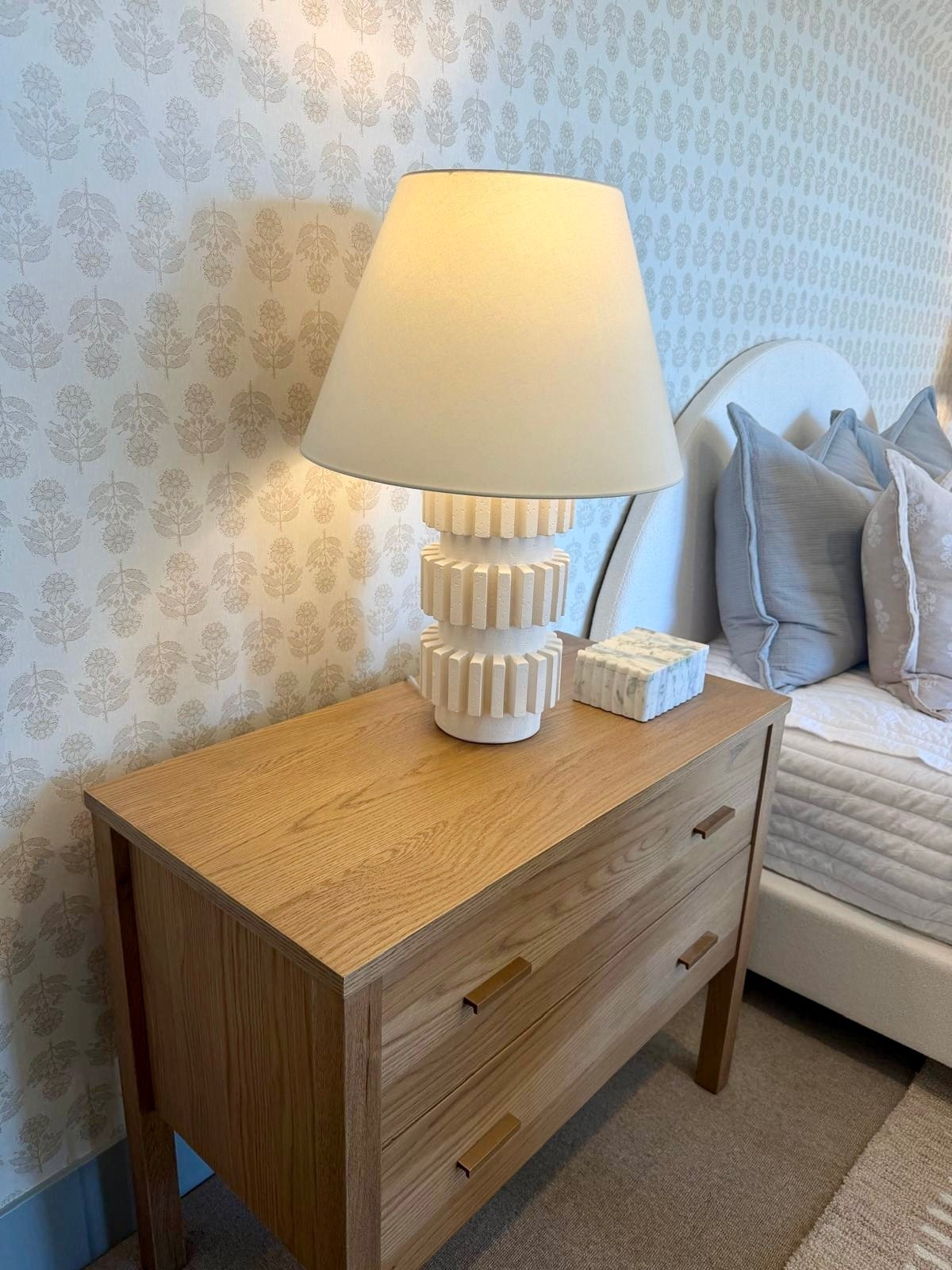 I’ve been using this table lamp to bring a soft, ambient glow to the bedroom, and I love how the sculptural base adds texture while still feeling clean and neutral. It pairs easily with wood nightstands and layered bedding for a warm, balanced look.

I like lighting that feels simple but still intentional, especially in bedside spaces. Sharing this one below if you’re looking for a table lamp that adds warmth and a timeless finish.
@Wayfair 
 @Amazon