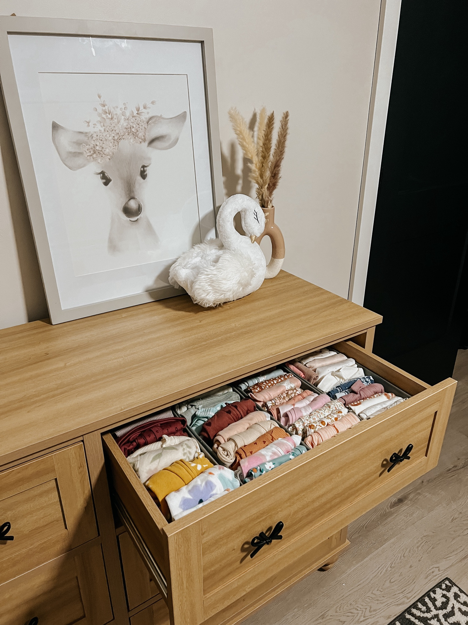 Nesting hardcore over here! Got baby girls dresser assembled and started organizing her drawers! Needless to say I need more drawer organizers but excited to get a start on it 🤍

Dresser is from my Texas house - not available online yet but will update when it is. Extremely good quality and very heavy duty!

Baby deer photo and vase are from hobby lobby!


Baby girls nursery, baby girl decor, organization, nursery organization 

#LTKhome #LTKsalealert #LTKbaby