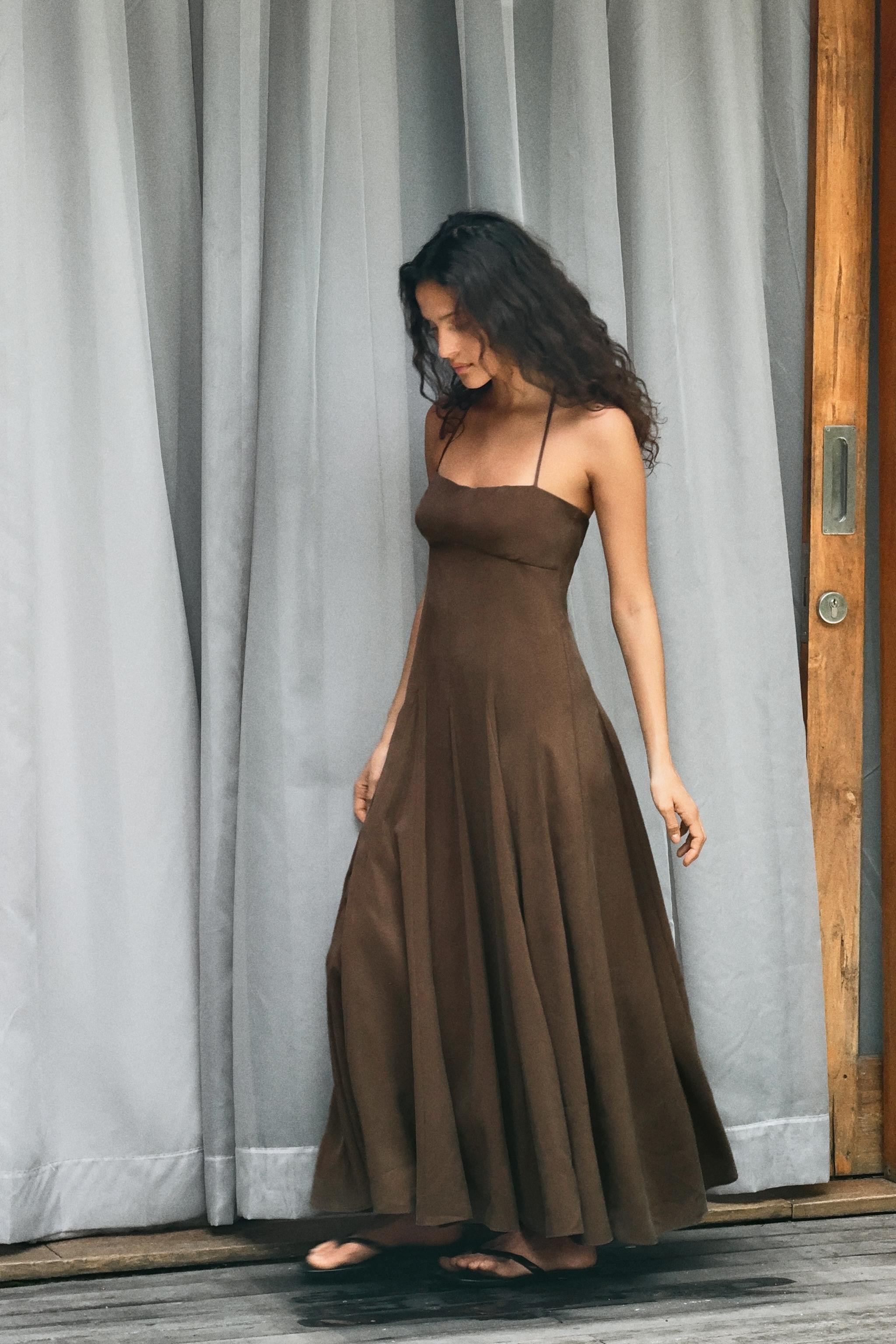Midi halter neck dress with adjustable tie and straight neckline. Back hidden in-seam zip closure... | Zara US