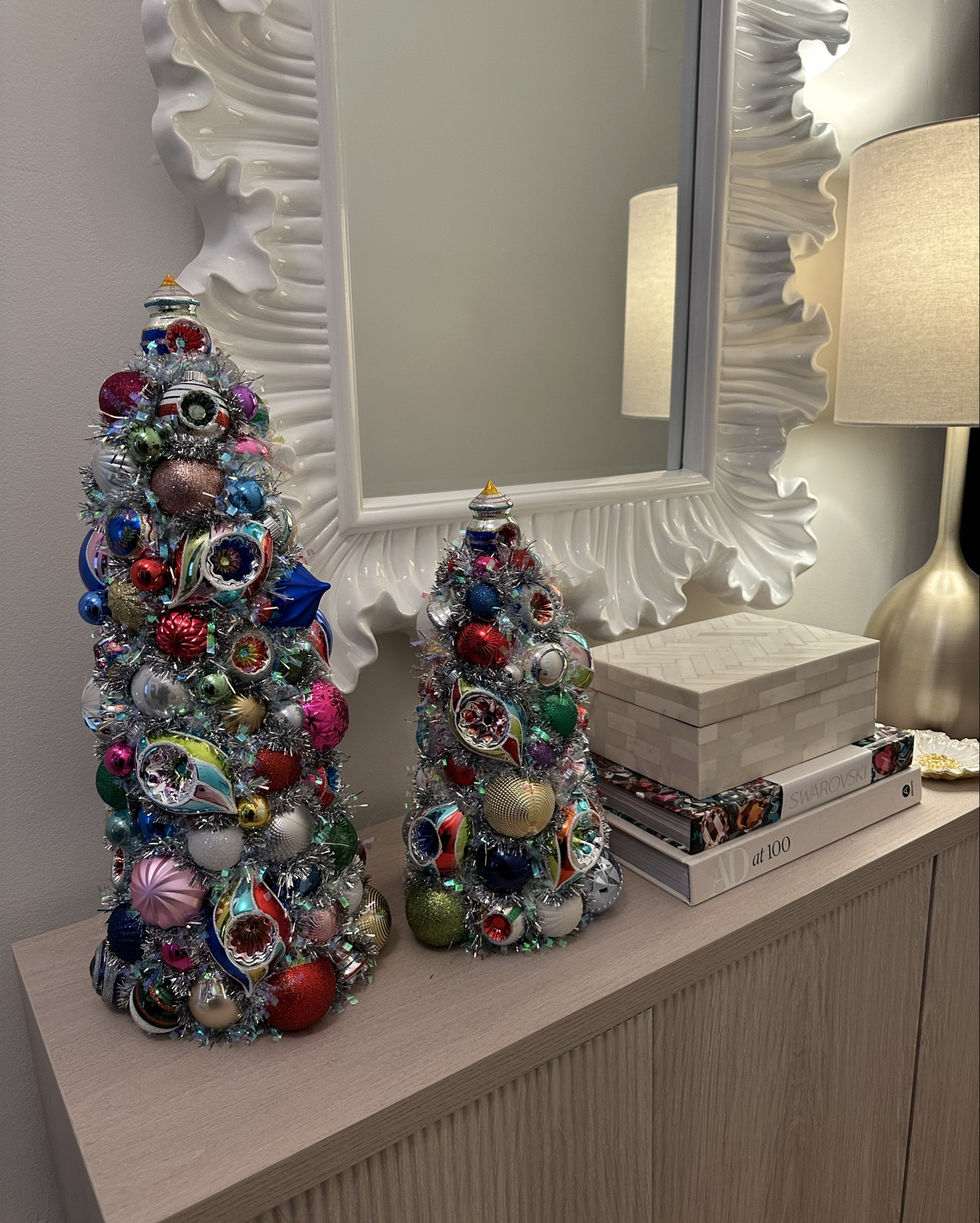 Bring the magic of vintage holiday décor into your home with my hand-crafted Tulip Shiny Brite Ornament Trees 🎄✨ Each tree is made using authentic 2.5” Tulip Shiny Brite ornaments, layered and assembled by hand for the fullest, most luminous heirloom look.

Available in Small, Medium, Large + choose your gold or silver tinsel base.
Perfect for mantles, entryways, dining rooms, bookshelves, nurseries, or holiday gifting. 🎁

Shop my full collection below — holiday home décor, vintage Christmas, Shiny Brite trees, and gift ideas all linked!

#holidaydecor #christmasdecor #vintagechristmas #shinybrite #ornamenttree #holidayhome #manteldecor #christmasgifts #holidayaesthetic #ltkhome #ltkgiftguide #ltksalealert #ltktrending

#LTKHoliday #LTKHome #LTKGiftGuide