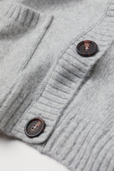 Boxy cardigan in soft, knit fabric with wool content. V-neck, buttons at front, and patch front p... | H&M (US + CA)