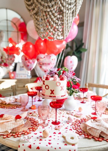 Valentine’s Day table. Tablescape. Red champagne coupes. Pink glasses. Heart table runner. Pink Estelle colored cake stand. Hearts. Galentine’s 

#LTKstyletip #LTKhome #LTKSeasonal