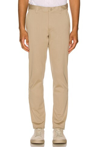 Rhone Commuter Pant Straight Leg in Khaki from Revolve.com | Revolve Clothing (Global)
