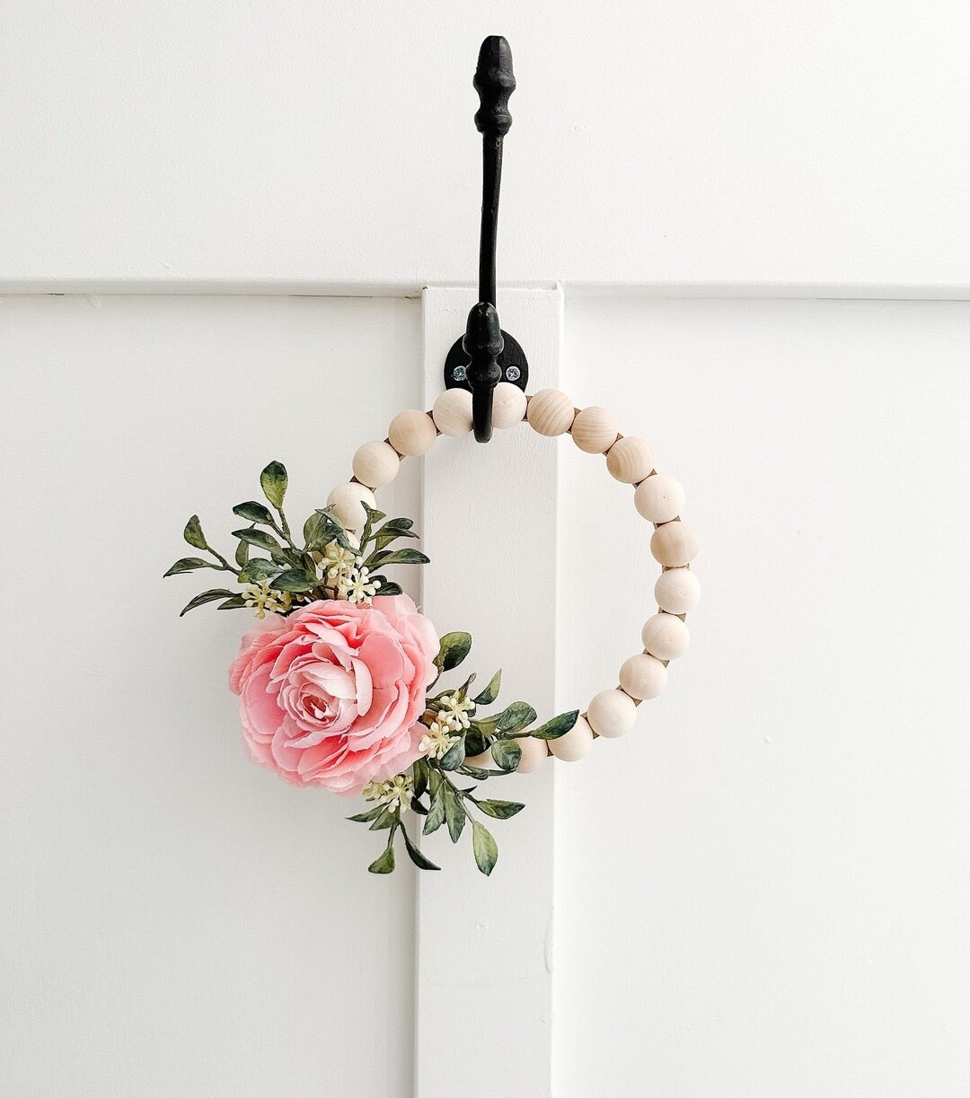 Add a soft feminine touch to your space with this charming wood bead wreath featuring delicate greenery and a pink ranunculus bloom. The natural split wood bead base creates a warm, modern farmhouse feel, while the petite size makes it perfect for a girls room, nursery, gallery wall, or small accent space. This sweet, handcrafted wreath also makes a thoughtful gift for birthdays, baby showers, or anyone who loves soft floral décor.

#LTKHome #NurseryDecor #GirlsRoomDecor #FarmhouseDecor #WoodBeadWreath #FloralDecor #SmallSpaceDecor #FeminineDecor #HomeDecorIdeas #GiftIdeas #ModernFarmhouse #WallDecor #PinkDecor #LTKFinds #HomeInspiration 

#LTKWedding #LTKSeasonal #LTKHome
