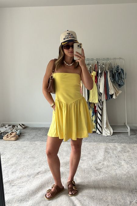 6/11/24 Summer dress outfit 🫶🏼 Summer dresses, summer dress, yellow dress, trucker hat outfit, birkenstock big buckle sandals, casual summer outfits, casual summer fashion