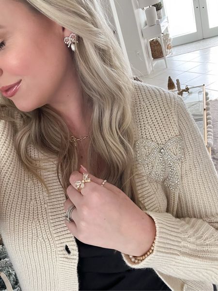 Bow season 🎀 is here! My cardigan and earrings are currently 50% off  with an extra 15% off with code: YAY and my ring is 40% off!! 

Loft, bow sweater, Kendra Scott ring, bow earrings, bow ring, holiday looks, festive sweaters, Ann Taylor, sale alert, Black Friday deal, fancythingsblogg

#LTKfindsunder50 #LTKsalealert #LTKCyberWeek