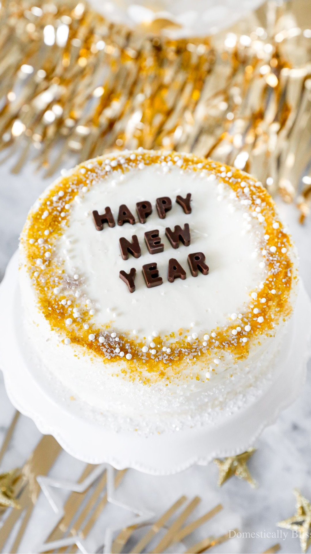 A quick and easy DIY Happy New Year’s Eve Cake using a store-bought cake and redecorating it with gold, silver, and white sprinkles and chocolate letters.

See details:
https://domesticallyblissful.com/diy-happy-new-years-eve-cake/

🔗 Join our newsletter: https://domesticallyblissful.com/newsletter/ 

#LTKSeasonal #LTKFindsUnder50 #LTKHome