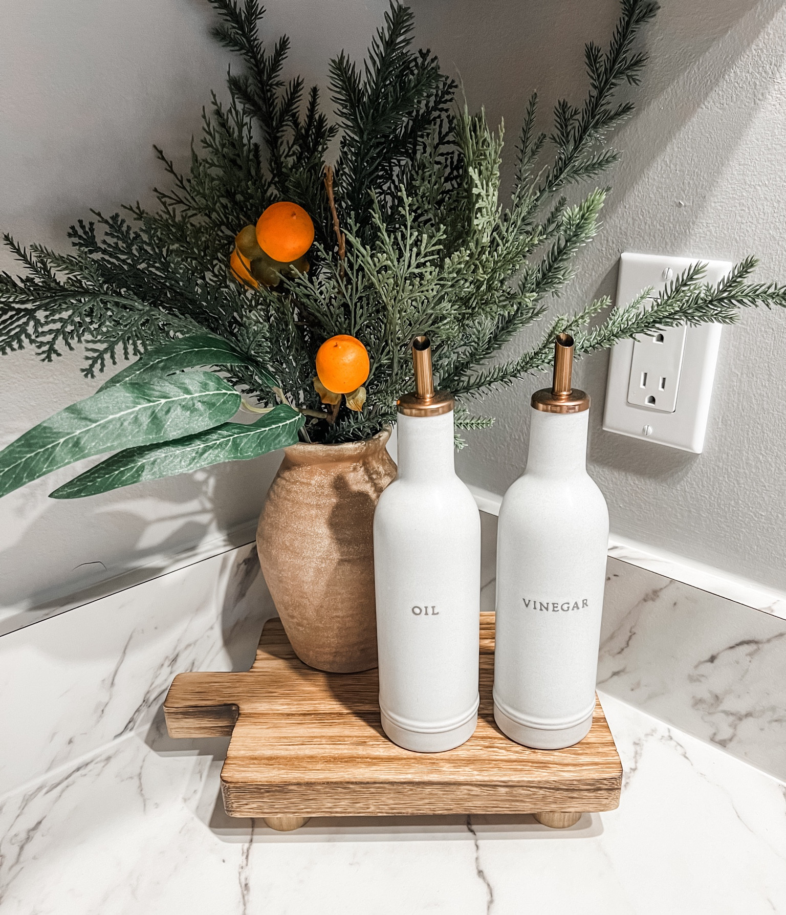 Kitchen corner Christmas decor 

winter foliage, Christmas vase, Christmas stems, oil and vinegar, minimal kitchen decor 

#LTKHoliday #LTKSeasonal #LTKhome