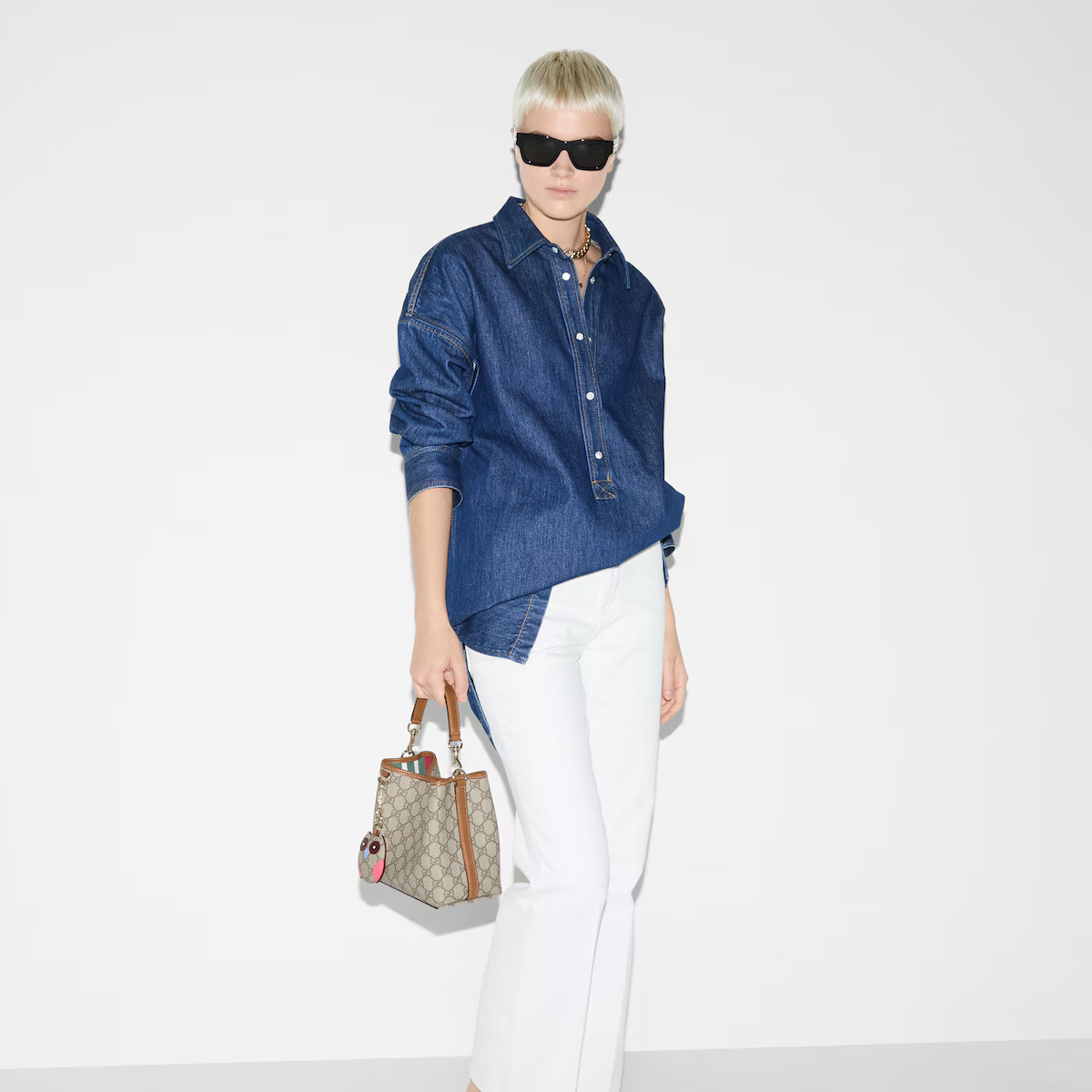 Gucci - GG Emblem small bucket bag | Gucci (US)