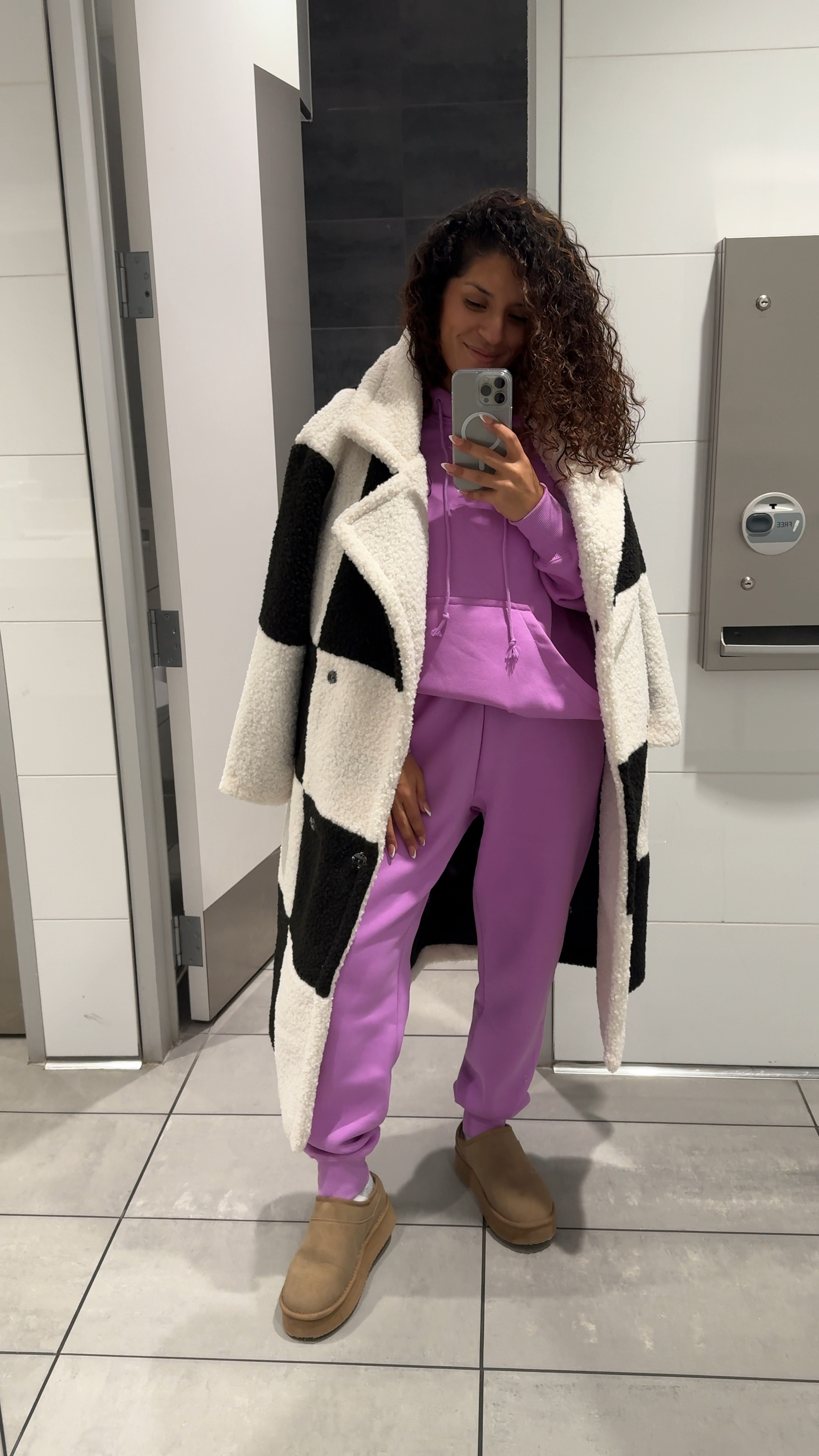 It’s travel day!  Wearing this super cozy @nike sweatsuit and a big coat I’ll be wearing in Chicago. #nike 

#LTKtravel #LTKCyberWeek #LTKVideo