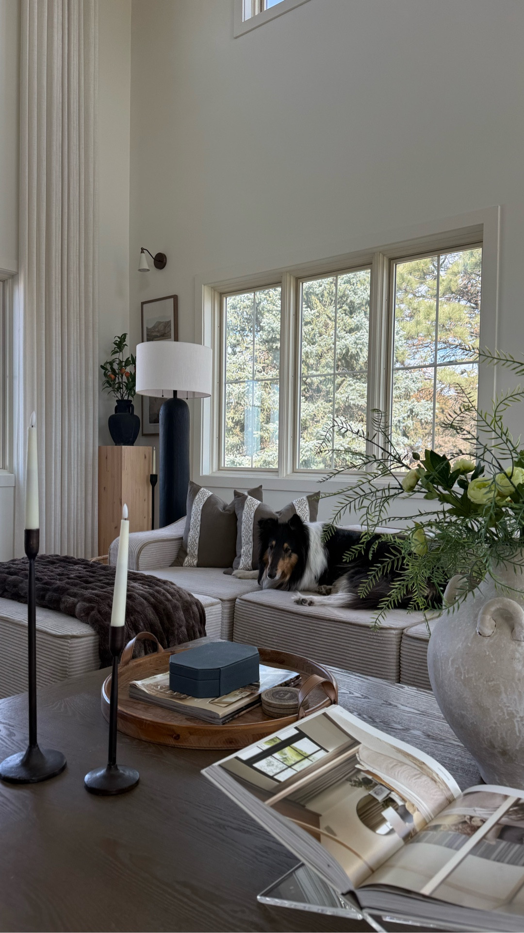 Coffee table styling ideas: a tray to hold things, a box to hide things, a vase for height and pretty, candles for an evening glow, and coffee table books to fill in missing spots. 

#homedecorating #livingroomdecor #coffetabledecor #homeinspiration #greatroom

#LTKHome