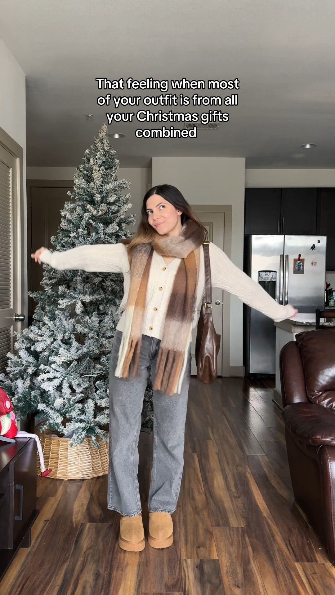 Casual winter outfit 🤎
Size small in cardigan & tank top
26 short in jeans 



Plaid scarf, brown plaid scarf, chunky scarf, grey jeans, loose jean fit Abercrombie jeans, ugg slippers, beige cardigan, winter outfits, winter style, platform Uggs 