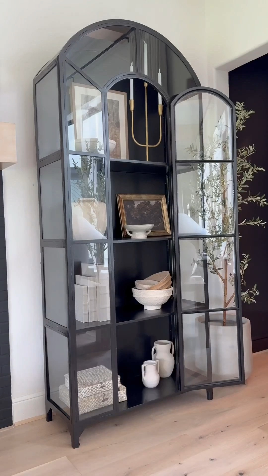 🤎
I've loved this classic cabinet for years plus it's truly a timeless piece that feels heirloom-worthy. ☺️ I love the
arched detail and glass panels that make it look like a work of art.

I now have three in my home! Two in the sitting room and one in the family room — and honestly, l'd add more if I had the space 😬😍

It's perfect for styling any room: dining area, next to a fireplace, bedroom, even an entryway. Solid and sturdy yet surprisingly easy to move. I love filling mine with neutral decor and adding a subtle pop of gold for warmth and contrast. A forever favorite 🖤

👉 I’ve linked the exact product plus similar options for easy purchase!#TimelessDesign #HeirloomQuality #HomeDecorFinds #ClassicStyle #InteriorInspo

#liketkit #LTKHome #LTKSaleAlert 
