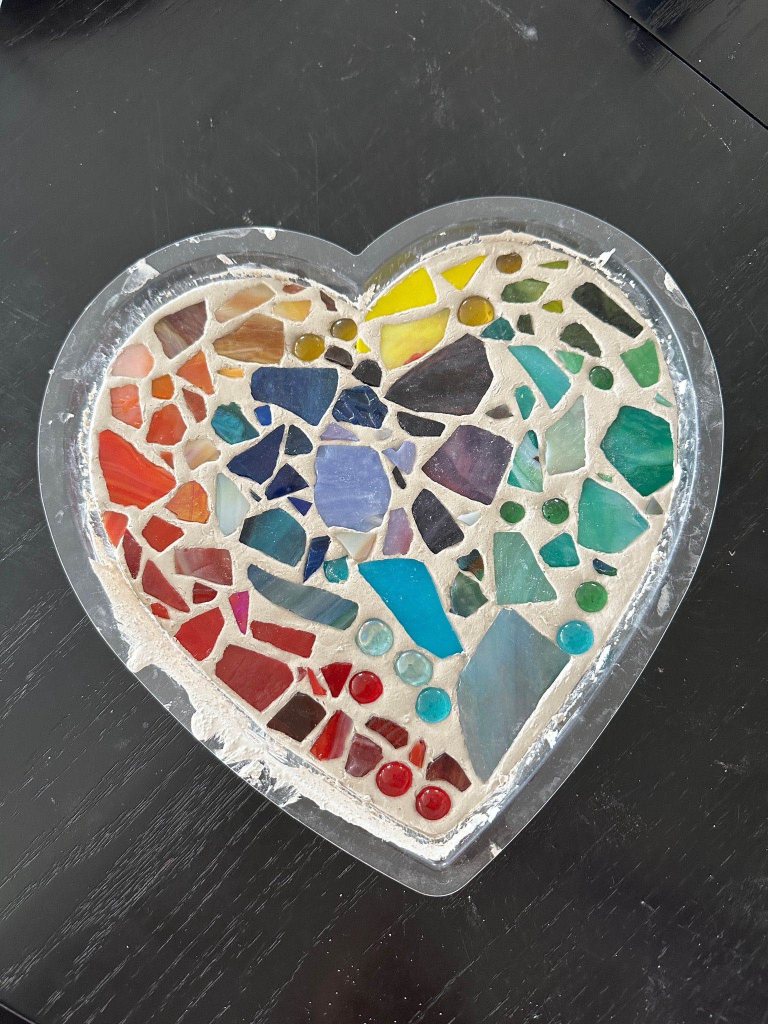 Found this fun DIY stepping stone mosaic kit - my 4 year old loved it. You mix the concrete, fill the mold, and then add the glass. They make lots of different shapes of molds and you can personalize them by carving text or hand / foot print. Super cute!

#LTKkids