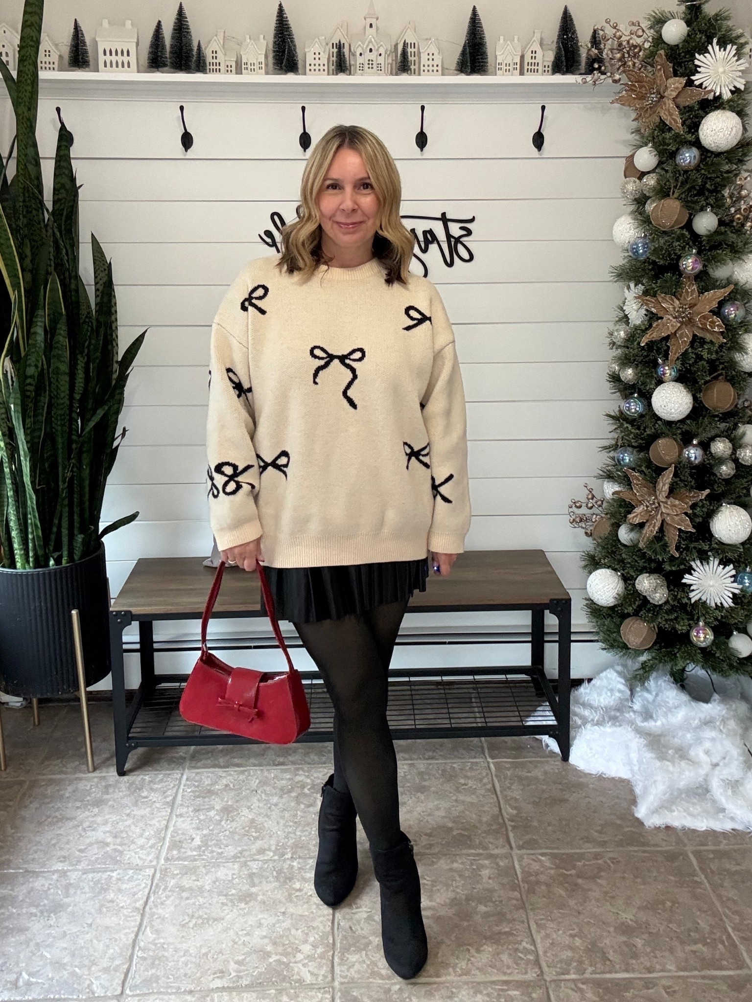 Holiday outfit idea! I’m wearing a large in the bow sweater for an oversized fit, a medium in the faux leather pleated skirt but would size up to a large (it’s tight in tummy area) and crazy warm fleece lined tights! Cute red purse and booties 🎁❤️

#LTKHoliday #LTKFindsUnder50 #LTKOver40