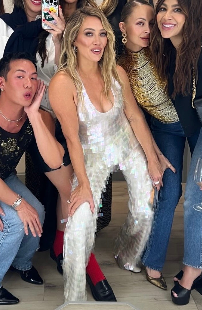 Shop Hilary Duff's silver top and pants ￼