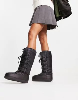 Truffle Collection high leg snow boots in black mono print | ASOS (Global)