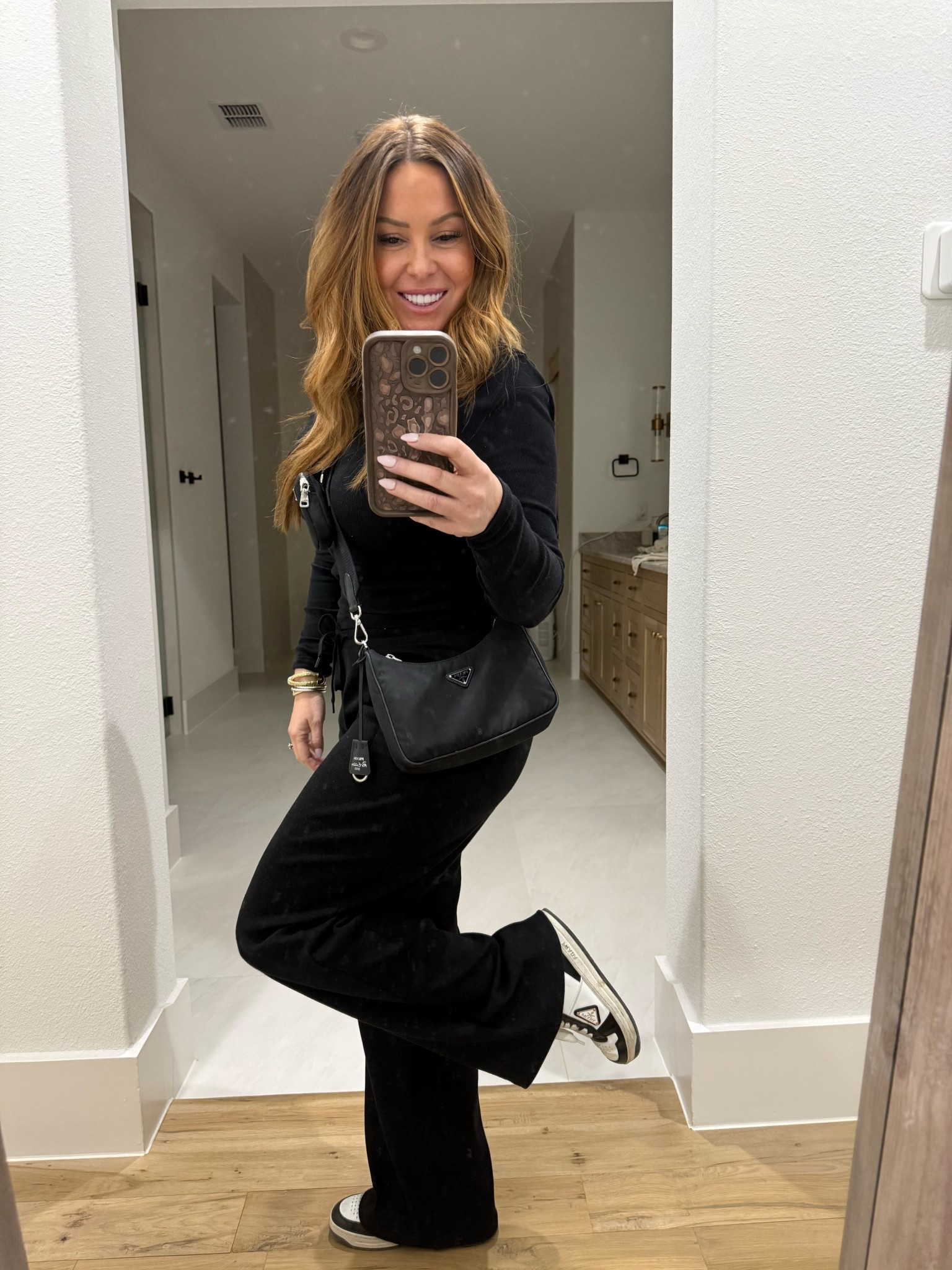 Volleyball tourney fit from Aritzia
Shoes and purse are Prada 
All black 

#LTKdayinmylife #LTKActive #LTKootd