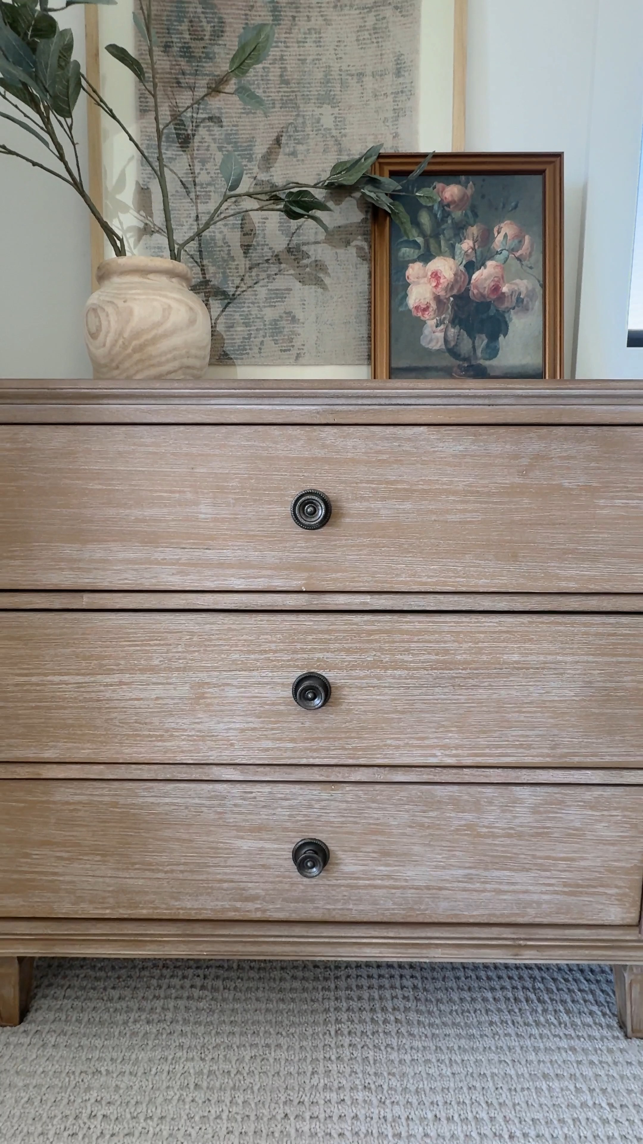 A view of our dresser with floral, neutral & green toned styling 🤎🌿

Dresser, bedroom furniture, chest of drawers, frame, styling decor, vase, green stems, flowers, 

 

#LTKWatchNow #LTKHome #LTKSaleAlert