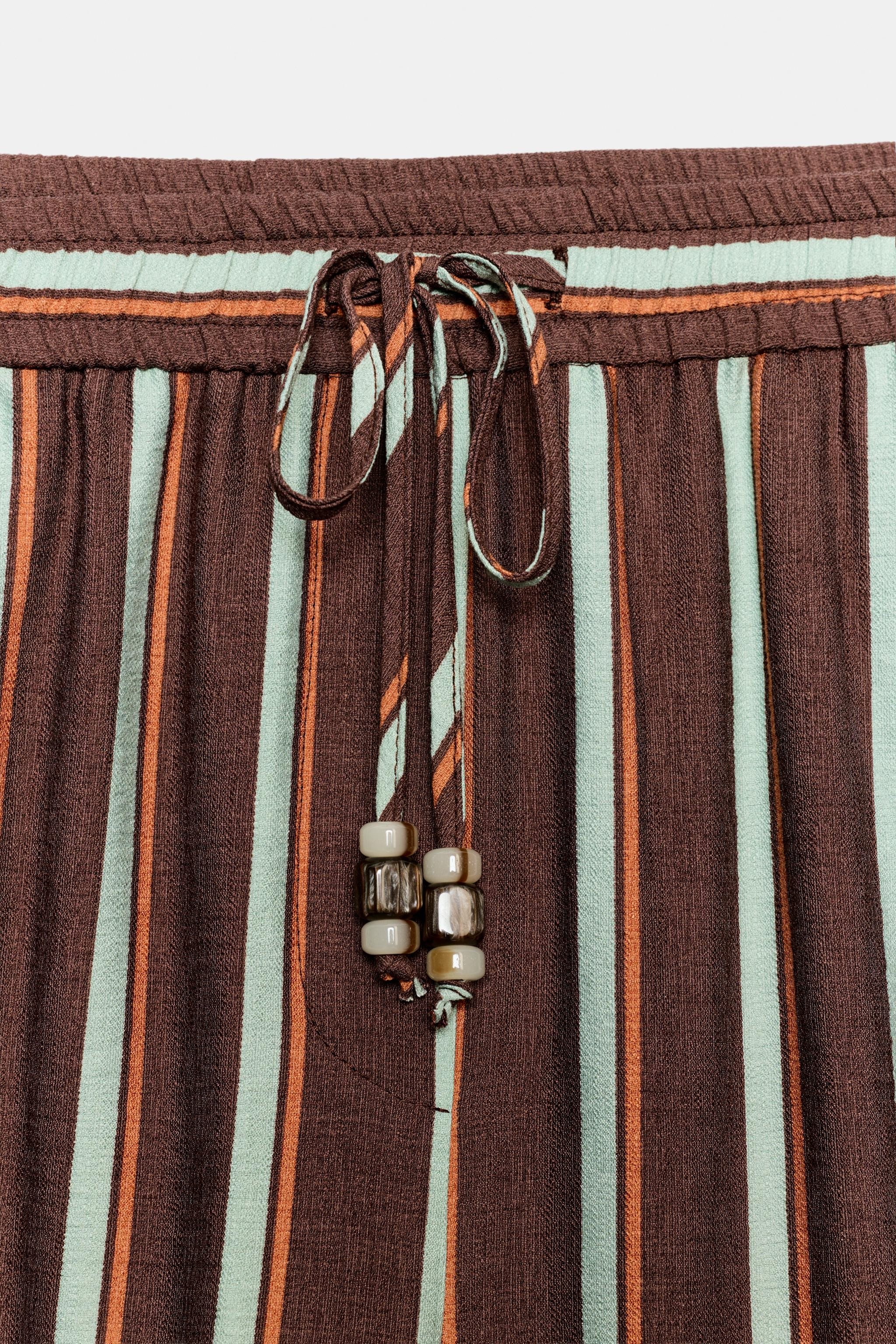 High-waisted pants with an adjustable elastic waistband featuring a drawstring with beads. Front ... | Zara US