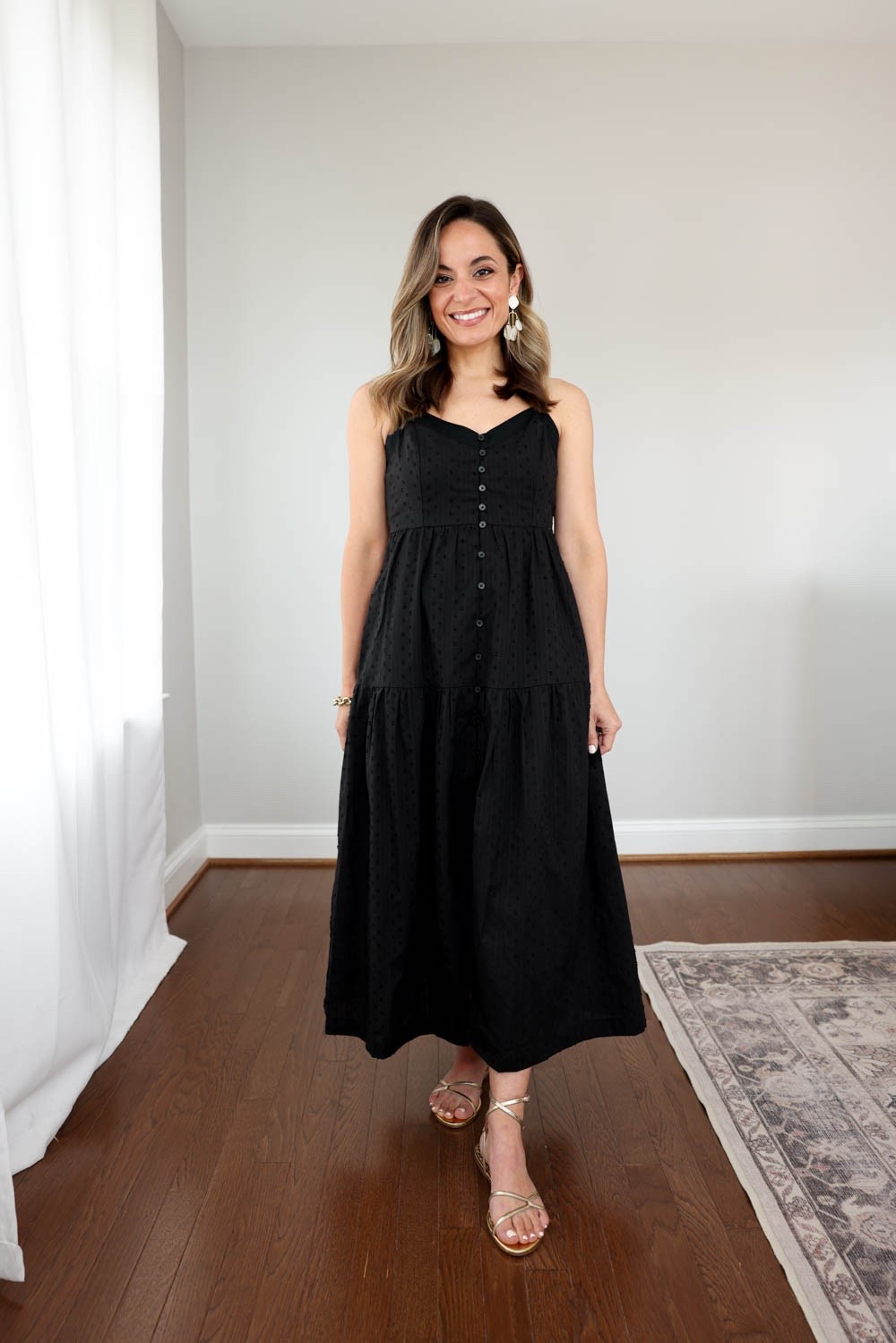 This Target dress is currently sold out in black but I saw it popped back up in white! I’m wearing xs here and it’s a great fit. Adjustable straps and a tie at the waist that ties at the back to adjust there. Lined to the bottom tier wear the dress opens.
