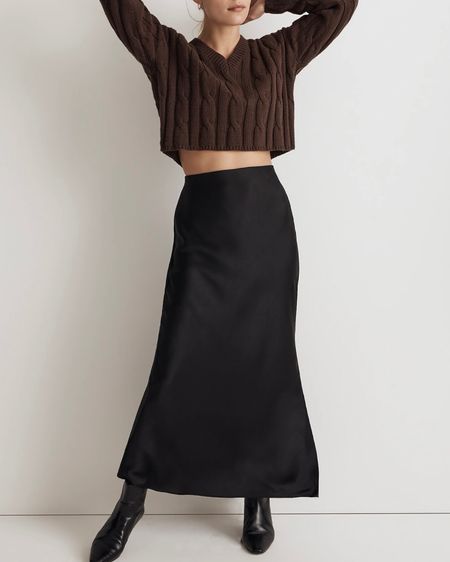 This whole look caught my eye because of the rich Fall colors and the mixing of textures and lengths. It’s a maxi side slit slip skirt in black with black ankle booties and a cropped length v-neck brown cable knit sweater. Chic, stylish work outfit.

#LTKstyletip #LTKSeasonal #LTKworkwear