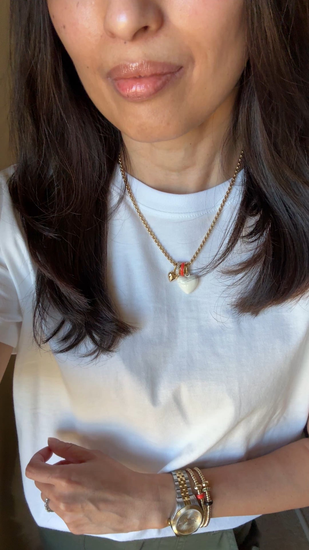 One of my most worn charm necklaces. I added a white heart; I also have a blue heart. 
Gold stretch bracelets have small charms also that add a bit of color. 
Both necklace and bracelets are good quality. 

Spring jacket  Everyday casual Spring outfit. 
Timeless style with good basics: 
- khaki jacket 
- white t-shirt
- casual cotton pants 
- sneakers 
- crossbody bag
- everyday jewelry 

Exact items:
- jacket:  I love a funnel neck. This athleisure style has great details, seems good material/ quality, and has a hidden hood. I sized up here, but going to exchange for my true size. Perfect spring jacket and would be good for travel. 
- favorite white t-shirt: wearing a size up here but I also wear true to size. 
- olive pants: cute casual style that is a nice change up from jeans or black athleisure bottoms. Size down. 
- crossbody bag: the strap makes the bag with the perfect pop of red against neutral stripes. Perfect for everyday essentials or as a travel bag. 
- white sneakers: trending slim profile ballerina style. 
- everyday gold jewelry with a hint of color. 


#LTKOver40