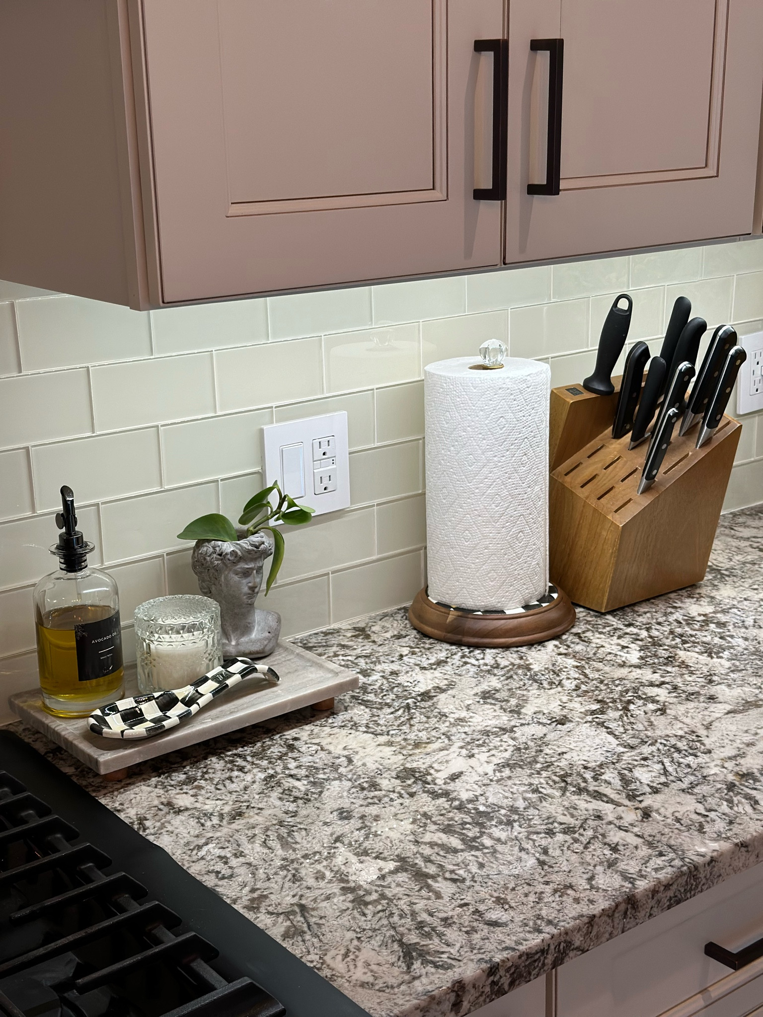 I love the combination of wood and classic checker patterns in our kitchen—they complement our patterned marble countertop perfectly. Together, they create a warm and inviting atmosphere, which is all I need to feel at home.

#LTKHome