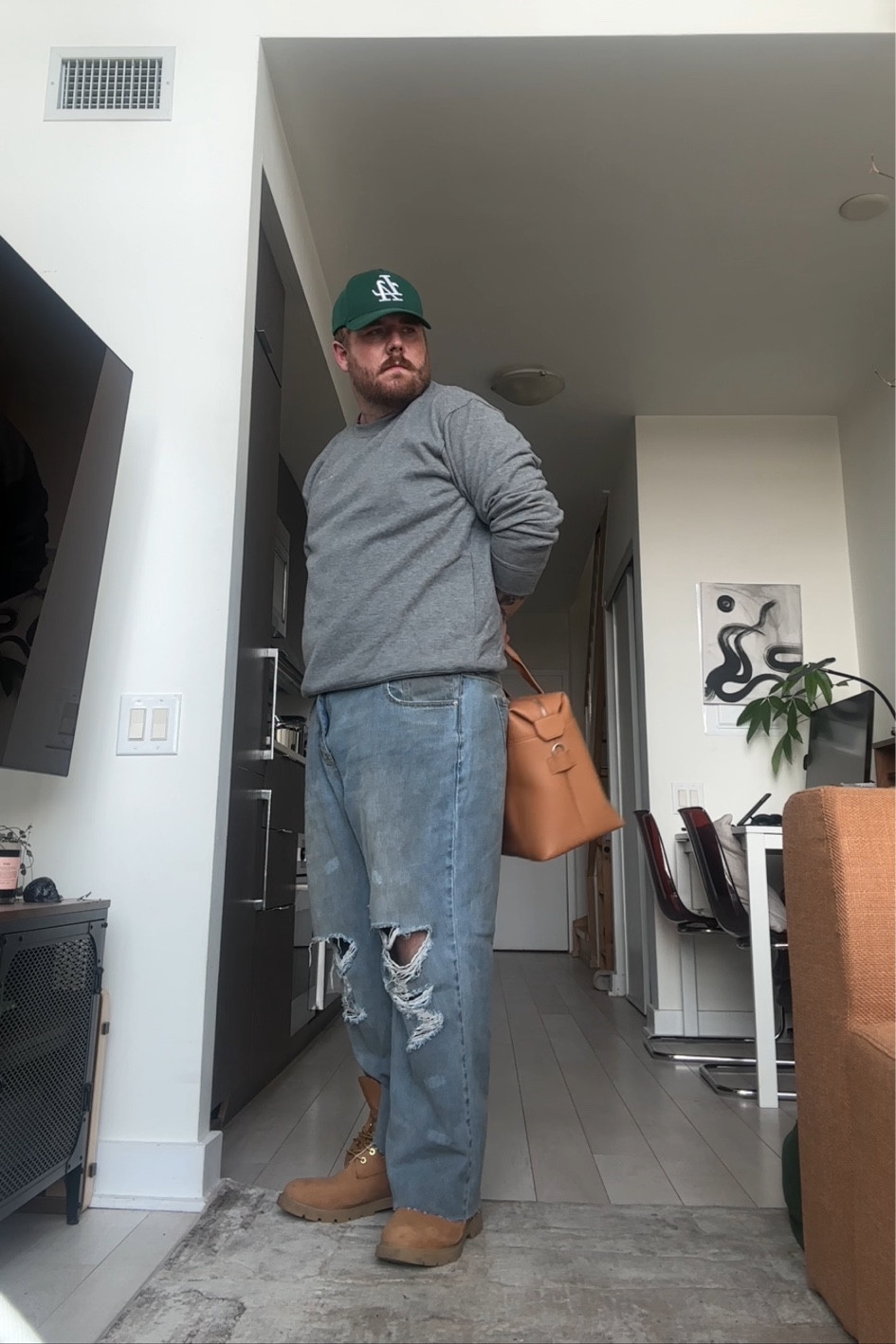 From my YouTube video styling jeans, five ways. 
Simple New York fall inspired outfit, distressed denim, timberlands, and a gray crewneck for a perfect fall. Look with a leather bag. I wear 2XL size 40 pants 

#LTKplussize #LTKworkwear #LTKmens