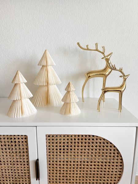 Love these accordion paper trees & gold reindeer from Amazon. Super cute boho chic Christmas decor! Linked more holiday decor + my cane tv console from Target!

// neutral boho Christmas decor, Christmas decorations, holiday decor, holiday decorations, home decor, gold reindeer, brass reindeer, paper Christmas trees, accordion paper Christmas trees, paper tree decor, neutral home decor, boho home decor, Amazon home, Amazon Christmas, Amazon finds, Target home, Target finds, tv console decor, tv console styling, tv console table, media cabinet, media console, living room furniture, living room decor, West Elm accordion paper trees dupe, holiday gifts, Christmas gifts, gifts for the host, gifts for the hostess (11.9) #LTKGiftGuide

#LTKfindsunder50 #LTKstyletip #LTKHoliday #LTKSeasonal #LTKparties #LTKhome #LTKfindsunder100 #LTKsalealert