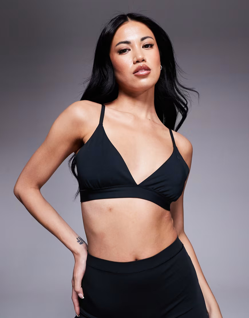 Nike Training Form light support triangle sports bra in black | ASOS (Global)