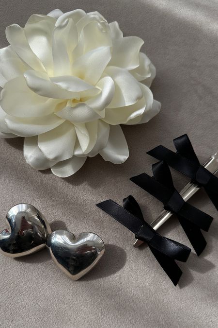 Dreamy accessories 🩶🩶
Silver puffy heart earrings | Black bow clips | Cream 3d flower necklace | Summer accessories | Wedding guest outfits spring 

#LTKstyletip #LTKsummer #LTKuk