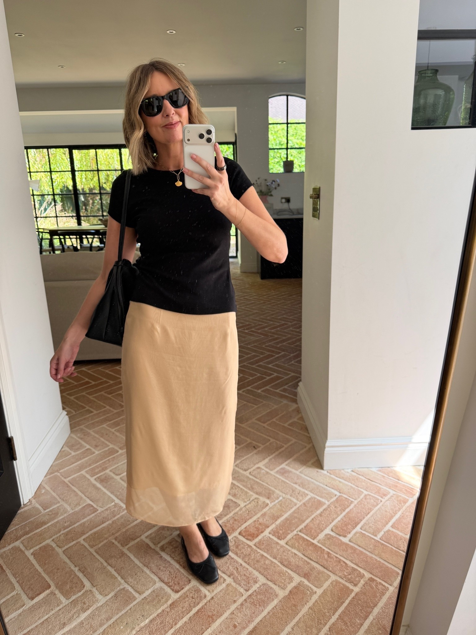 camel midi skirt, tan satin skirt, camel slip skirt, beige midi skirt, satin column skirt, black fitted tee, black crew neck t-shirt, black and camel outfit, neutral contrast outfit, black shoulder bag, black crossbody bag, black leather bag, black loafers, square toe loafers, black ballet flats, black sunglasses, gold pendant necklace, coin necklace, gold jewellery, how to style a midi skirt, t-shirt and skirt outfit, smart casual look, effortless chic, quiet luxury outfit, French girl style, minimalist fashion, classic outfit ideas, mum style, stylish mum outfit, over 40 style, ageless fashion, mirror selfie style, neutral outfit ideas

#LTKsummer #LTKuk #LTKdatenight
