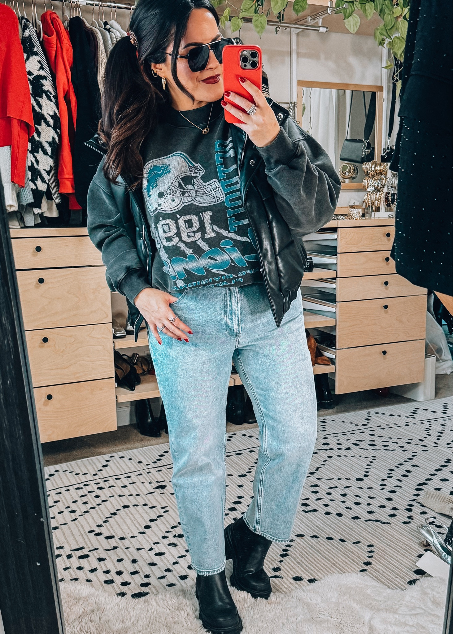 Casual midsize football game outfit 
Detroit lions sweatshirt large 
Straight leg jeans sized up one to a 33 (no stretch) 
Lug sole boots tts 
Faux leather vest large 

#LTKmidsize #LTKSeasonal #LTKsalealert