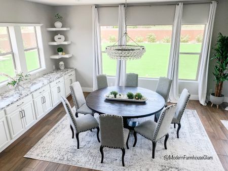 Dining room at Modern Farmhouse Glam. Round dining room wooden tables. Neural white and grey area rug. Chandelier. Home decor furniture Pottery Barn Wayfair  

#LTKhome