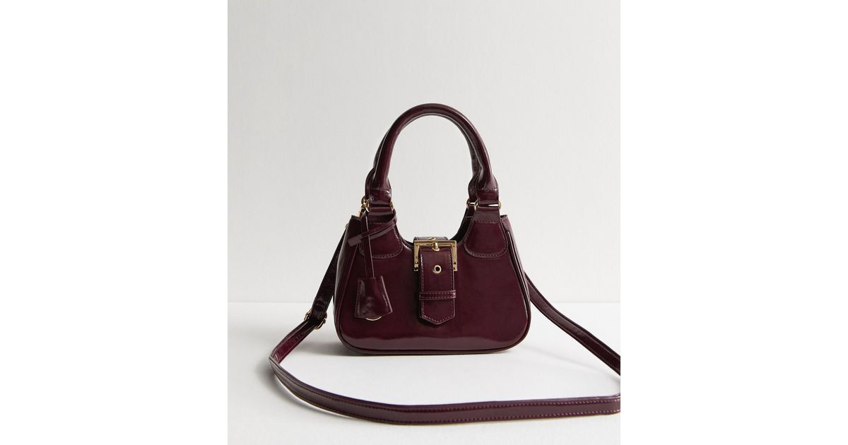 Burgundy Leather-Look Buckle Crossbody Mini Bag 
						
						Add to Saved Items
						Remove fro... | New Look (UK)