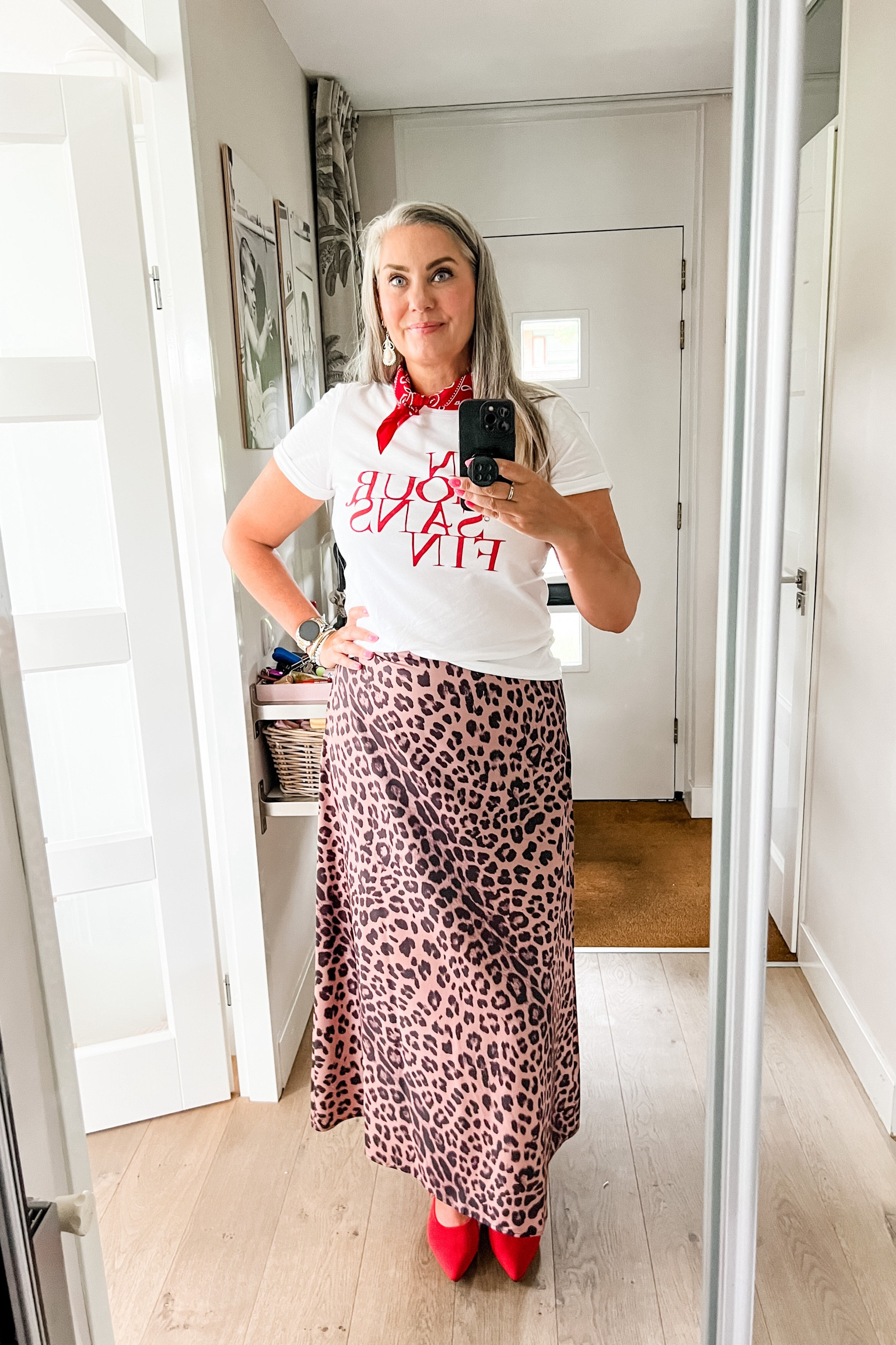 Ootd - Friday. Satin leopard skirt paired with a graphic print t-shirt, a red bandana and red Mary Jane Vivaia shoes. Earrings are from Morocco. 




#LTKmidsize #LTKnederlands #LTKeurope