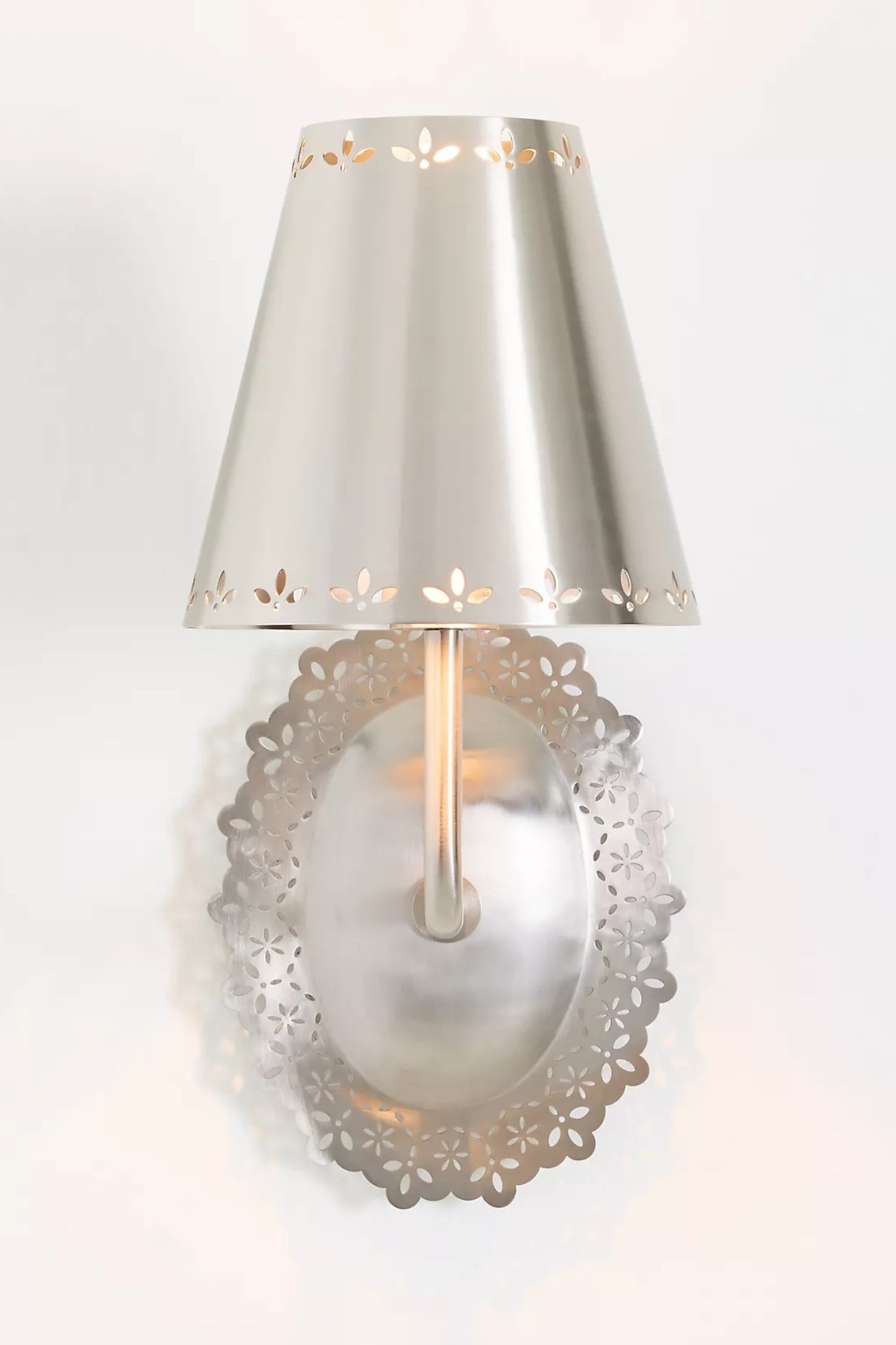 Lacie Lace Trimmed Antique Nickel Sconce

Crafted from steel with a tapered shade and oval mounting plate, this flush mount light features an antique nickel finish. Delicate perforations trim the shade and mounting plate with lace-inspired detail.

#LTKHome #LTKmomlife