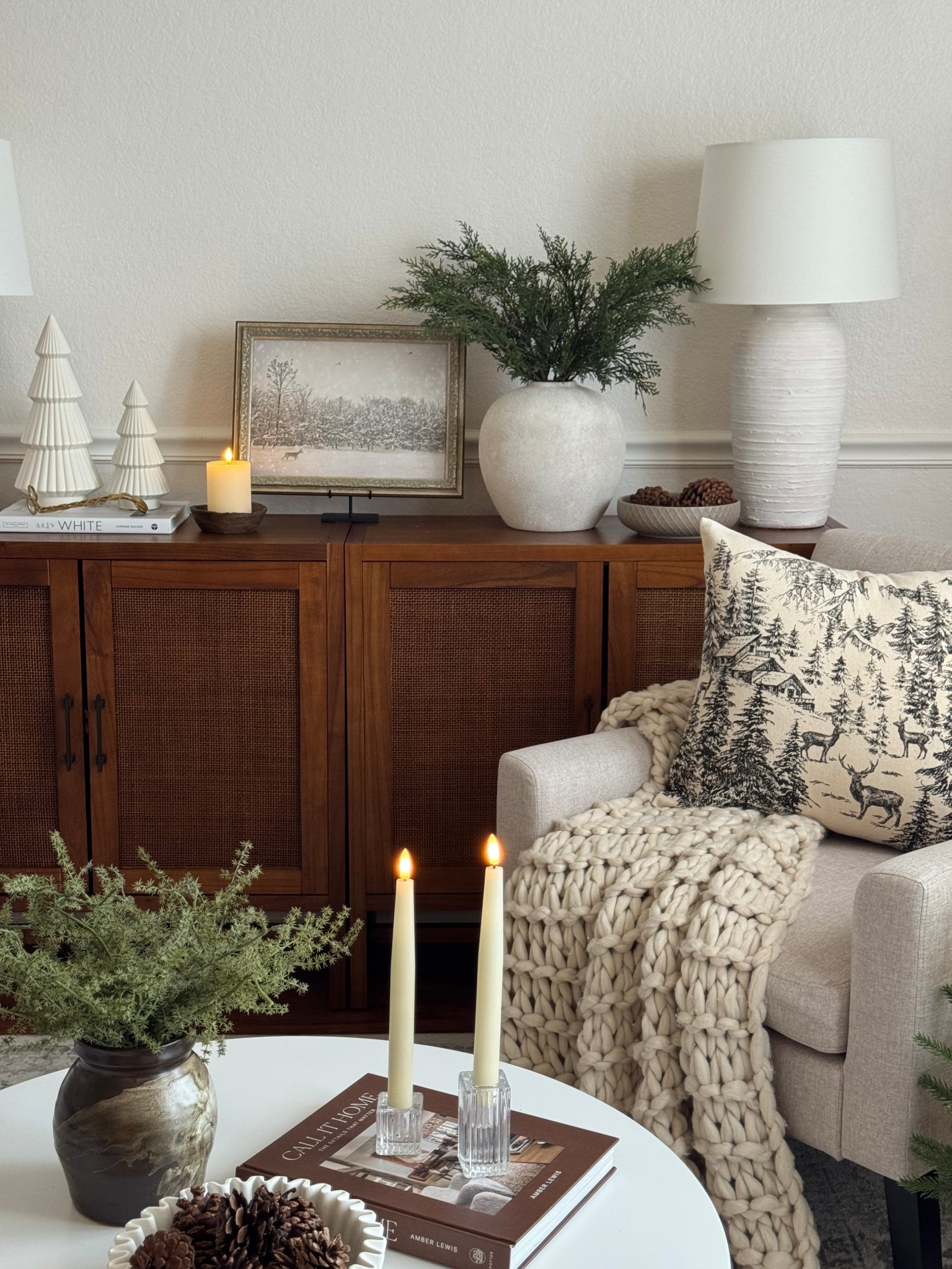 Christmas living room! Neutral Christmas theme with cedar stems and a Christmas pillow

#LTKSeasonal #LTKHome