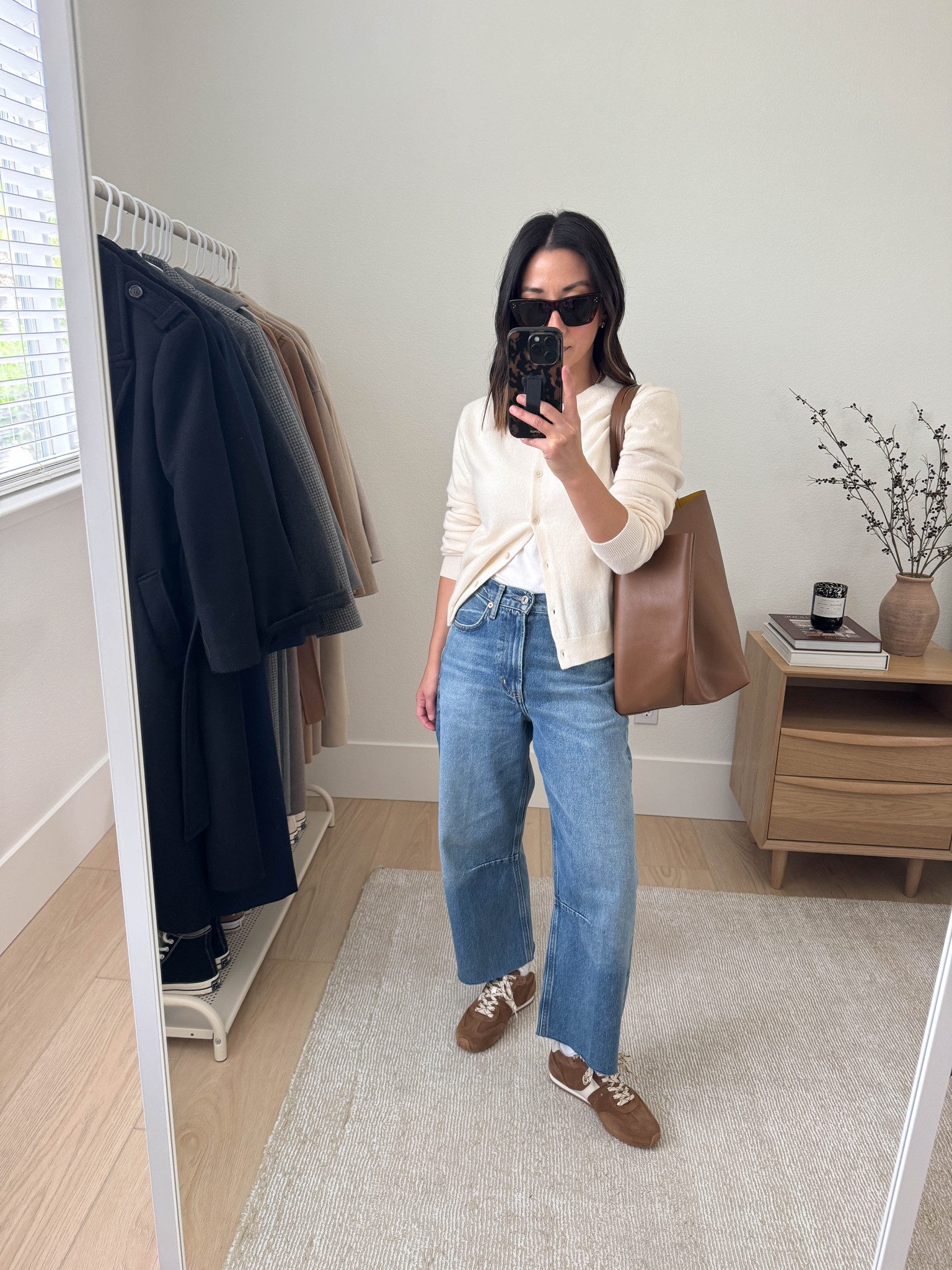 Easy barrel jean outfit with a shorter cardigan styled open. I'm also obsessed with these sneakers. They're elevated and so comfortable. They do run small, size up. 

Aritzia cardigan small
Everlane tee medium
Citizens of Humanity Miro jeans 24. Run big. Cut hems
Larroude sneakers 6, run small
Mansur Gavritel tote
Celine sunglasses


#LTKPetite #LTKStyleTip #LTKSeasonal