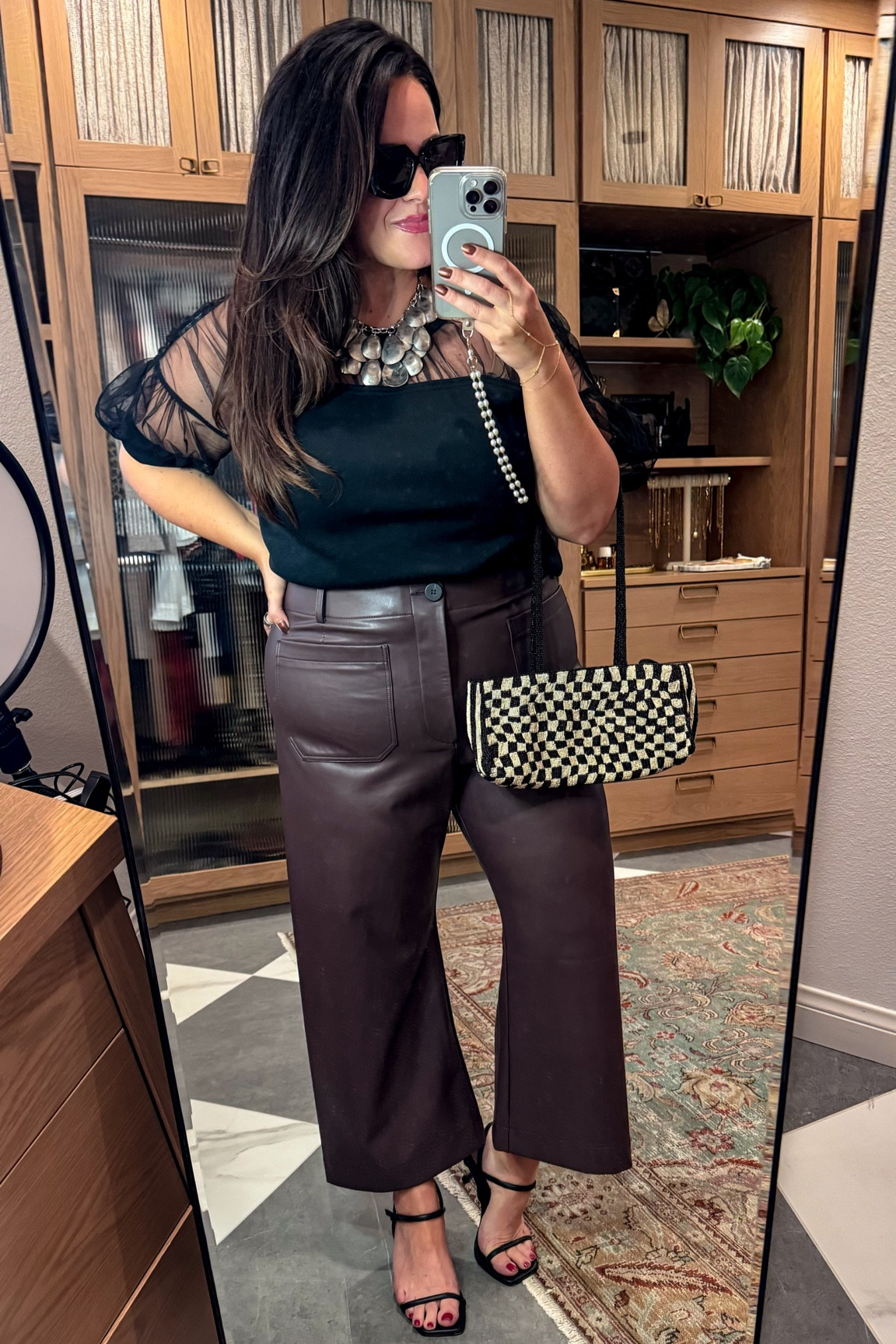 Date night dinner outfit- midsize fall transition outfit 
Statement top xl
Chunky necklace 
Faux leather stretchy chocolate brown pants tts if you have a tummy and want them a little looser a size up doesn’t hurt! 
Black kitten heel sandal 
Beaded checkered bag 


#LTKStyleTip #LTKSeasonal #LTKMidsize