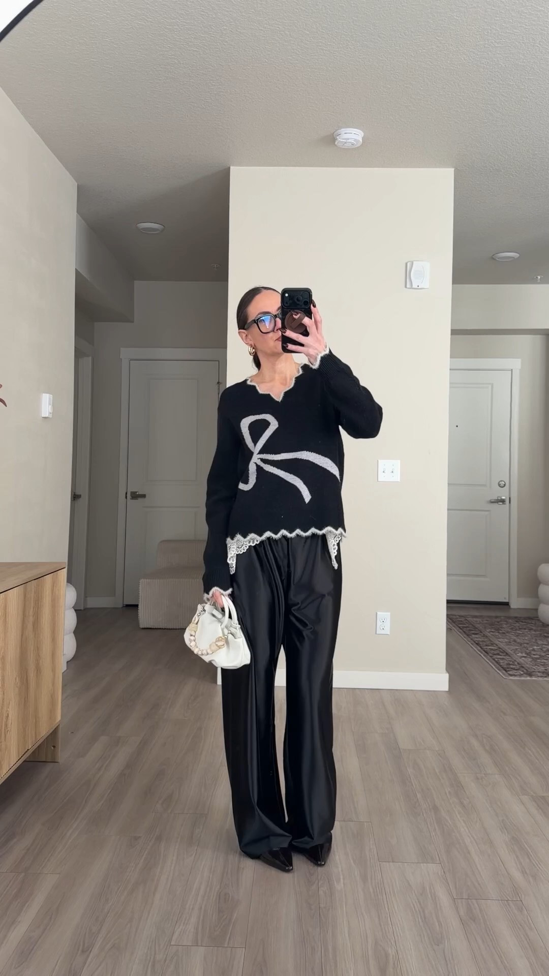 black sweater with bow.  valentine's day sweater. black satin pants.  pointed toe flat shoes 


#springfashion #satinpants #blackpants #valentinesdayoutfit #monochromaticfashiom #coolgirlfashion