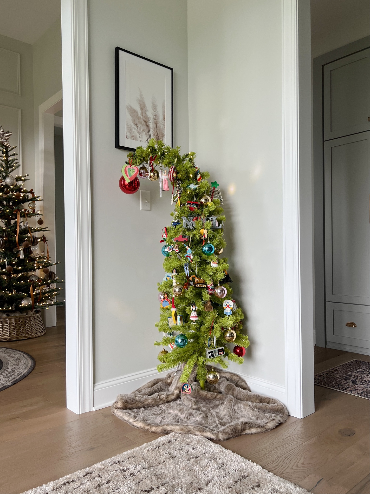 Behind every beautiful aesthetically pleasing tree should be a fun tree! In love with this grinch tree from @loweshomeimprovement, which my kids had a blast decorating with all of their fun and exciting ornaments! 
#lowespartner #lowesfind #christmasdecor #interiorstyling #christmastree #interiors #grinchtree 

#LTKHome #LTKSaleAlert #LTKSeasonal