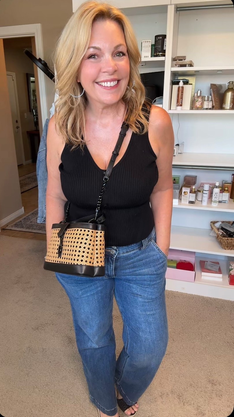 I’m wearing a black ribbed V-neck sweater tank with relaxed straight-leg jeans, my straw and black leather crossbody bag, and black sandals. It’s easy but put-together — one of those business casual looks that works for errands, meetings, or just feeling confident and comfy at midlife. 

#LTKMidsize #LTKOver40 #LTKSummerEdit