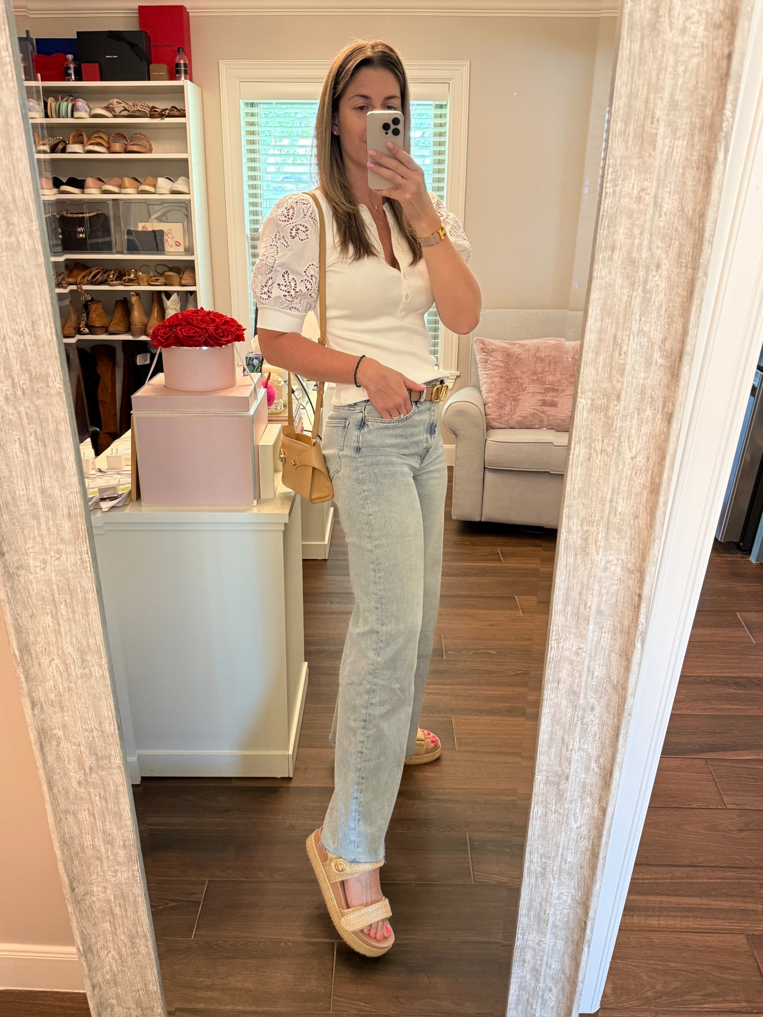 Classic with a twist today. White eyelet top with a puff sleeve for a modern flair, paired with light wash wide leg jeans for a relaxed working look. Finished with these raffia wedge sandals which are on sale for under $50!

Too runs TTS. Wearing a size small. 
Jeans run TTS. Wearing a size 28. 
Sandals run TTS. 

#LTKFindsUnder50 #LTKOver40 #LTKFindsUnder100