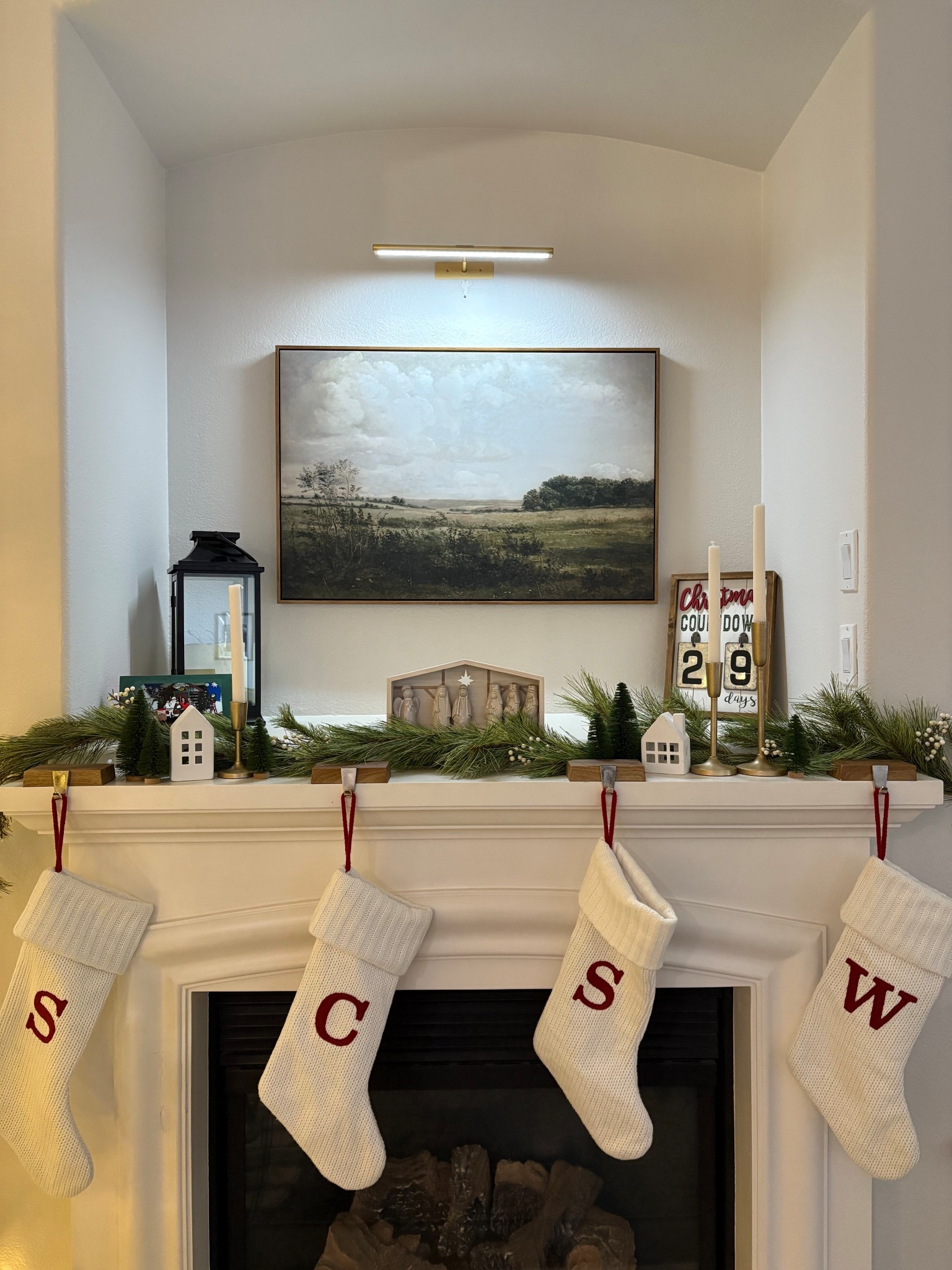 Updating this wall above our fireplace to this gorgeous landscape framed canvas with a gallery light that is rechargeable and incredibly easy to installl

#LTKFindsUnder100 #LTKHome #LTKHoliday