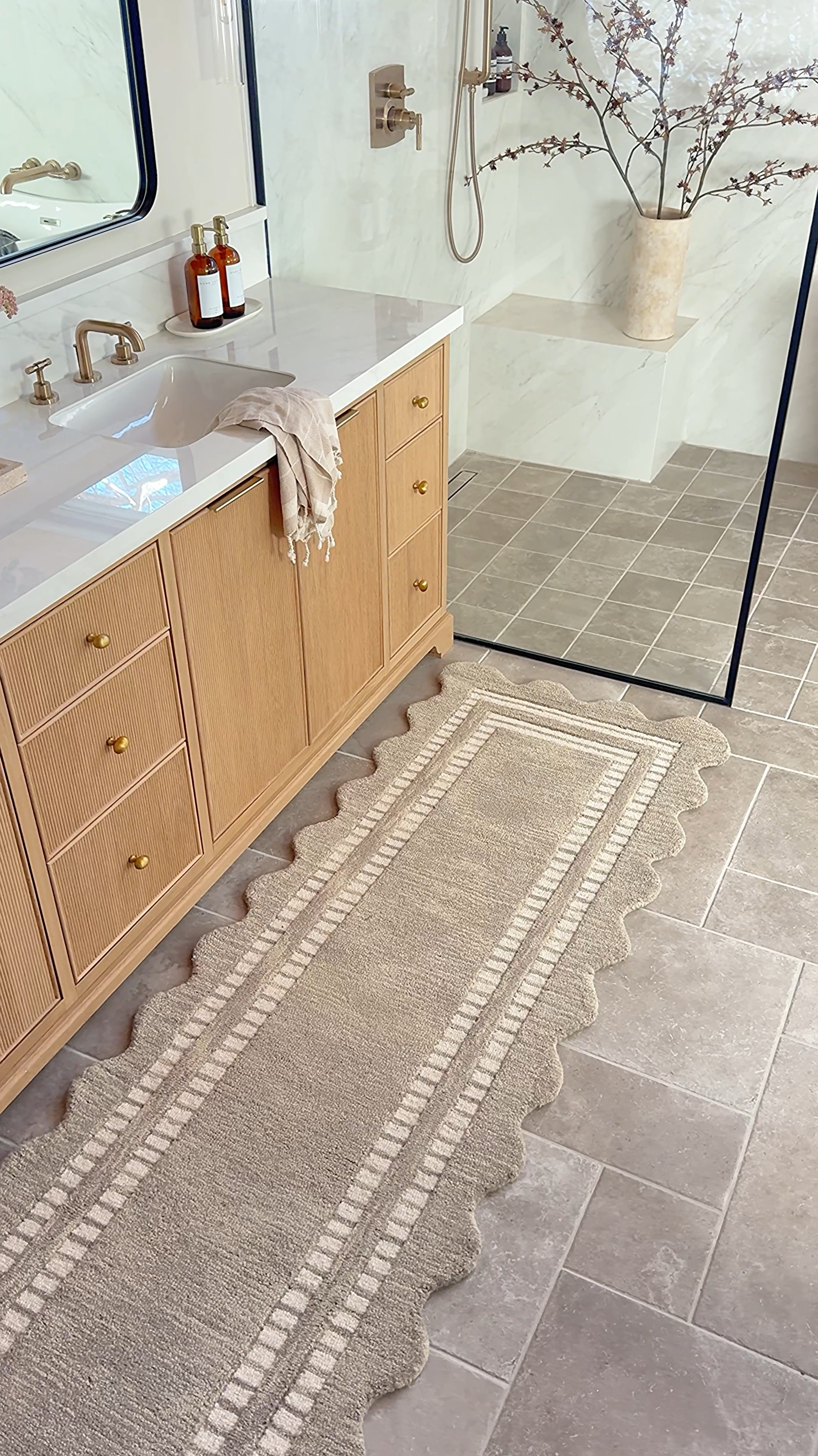 Wayfair is having their 48 hour clearance sale and it ends today! This rug is part of the sale. It’s showing in the listing as it’s back ordered, but I received mine really quickly and it’s always back ordered so if you love it as much as I do now is a great time to get it!  

The scallop detail on this runner is SO pretty! I love the warmth it adds to our space and we the perfect little refresh in our space! Such a great price and high-quality. You can even get a large size rug for only $500! 

The link may show its backordered but it came really fast for me 

Wood vanity, gray tile, Shower Glass door, rectangular mirror medicine cabinet, brass sconces, brass shower faucet glass sconces shower plumbing rectangle black mirrorr

#LTKSaleAlert #LTKFindsUnder100 #LTKHome