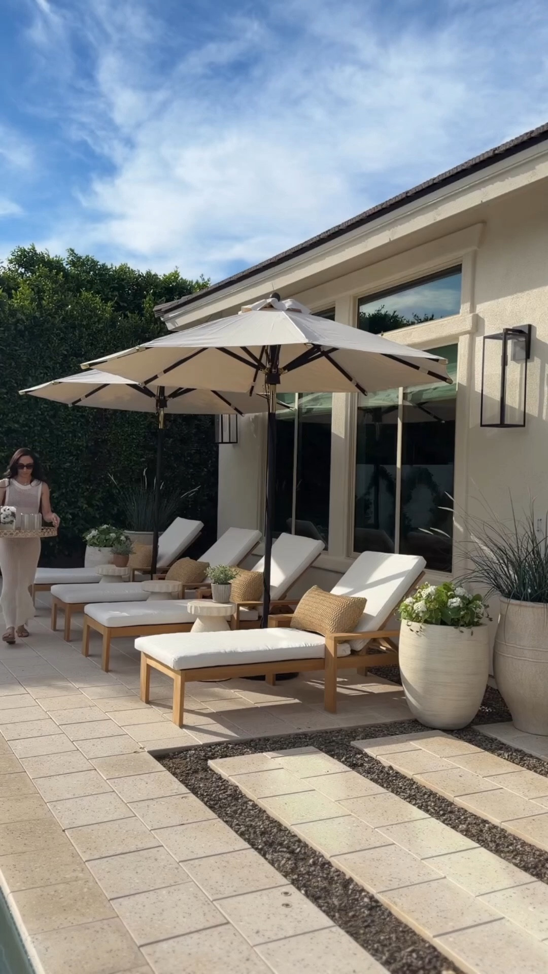 Poolside days are even better when the space feels just as elevated as the rest of your home. We recently partnered with @PotteryBarn and styled this poolside moment with four chaise lounges, beautiful accent tables, and adjustable tilting umbrellas for the perfect mix of comfort and shade. I also added their durable poolside serve ware that looks like glass and ceramic but is designed for outdoor living, along with a few outdoor lumbar pillows for the perfect finishing touch.



#LTKSeasonal #LTKHome #LTKSpringSale