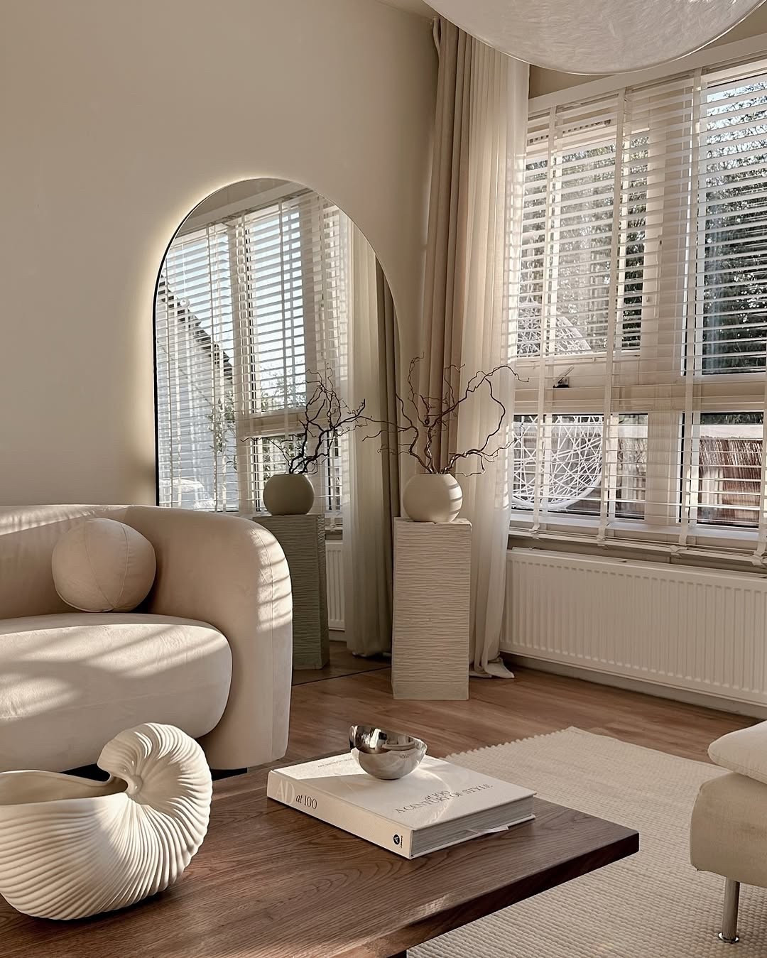 Letting the light do all the talking in this cozy, sculptural space 🤍 Every piece — from the arched mirror to the shell-inspired vase — brings softness and flow. I love how the neutral palette feels fresh but lived-in, making it the perfect place to unwind. If you’re into organic textures and timeless shapes, everything is now linked on my LTK! #HomeGoals #LTKFinds #WarmMinimalism #SoftInteriors

#LTKSeasonal #LTKHome #LTKActive
