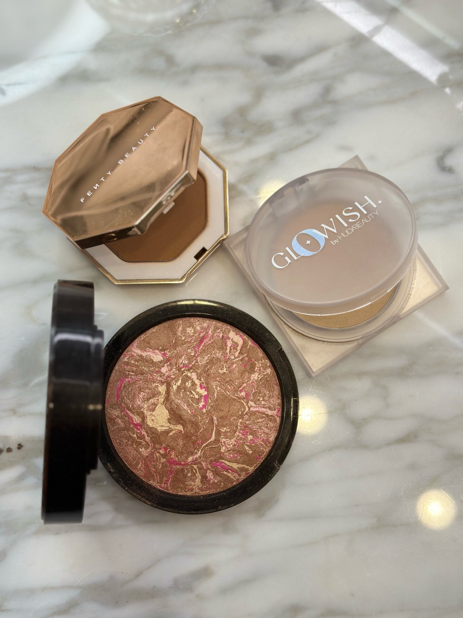 Staples! 
Fenty beauty bronzer in shade private island 
Glow wish pressed powder in  02 fair light 
Lise watier bronzer in Havana